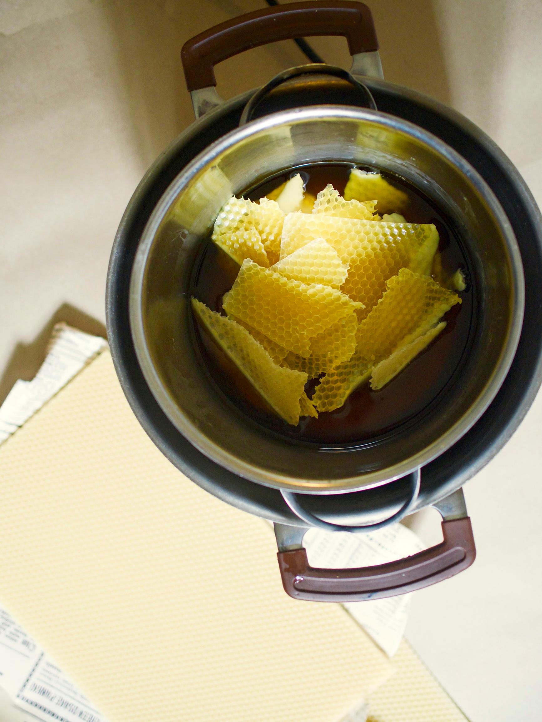 Melting beeswax in a pot