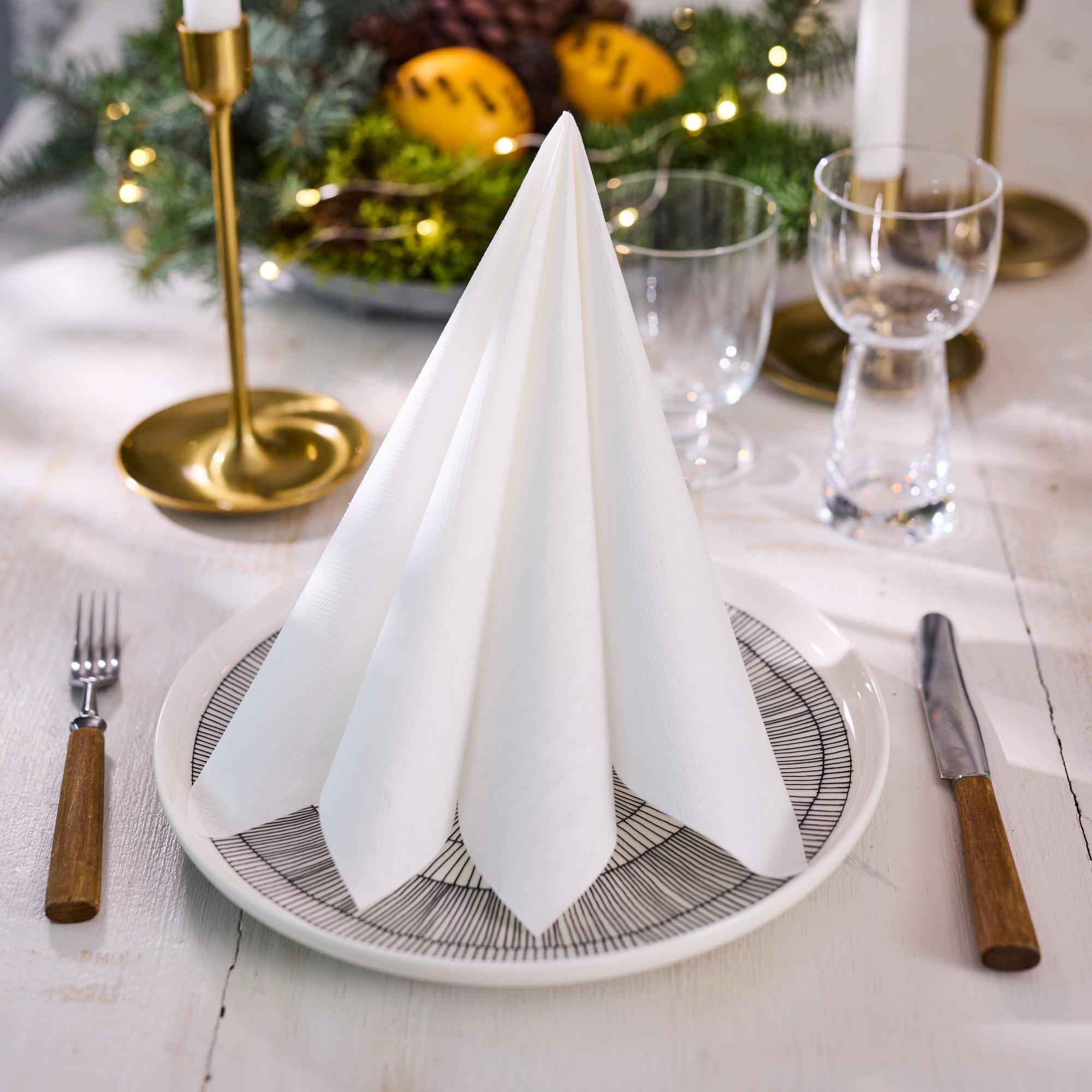 Fold a minimalist Christmas tree napkin—see the super-easy how-to