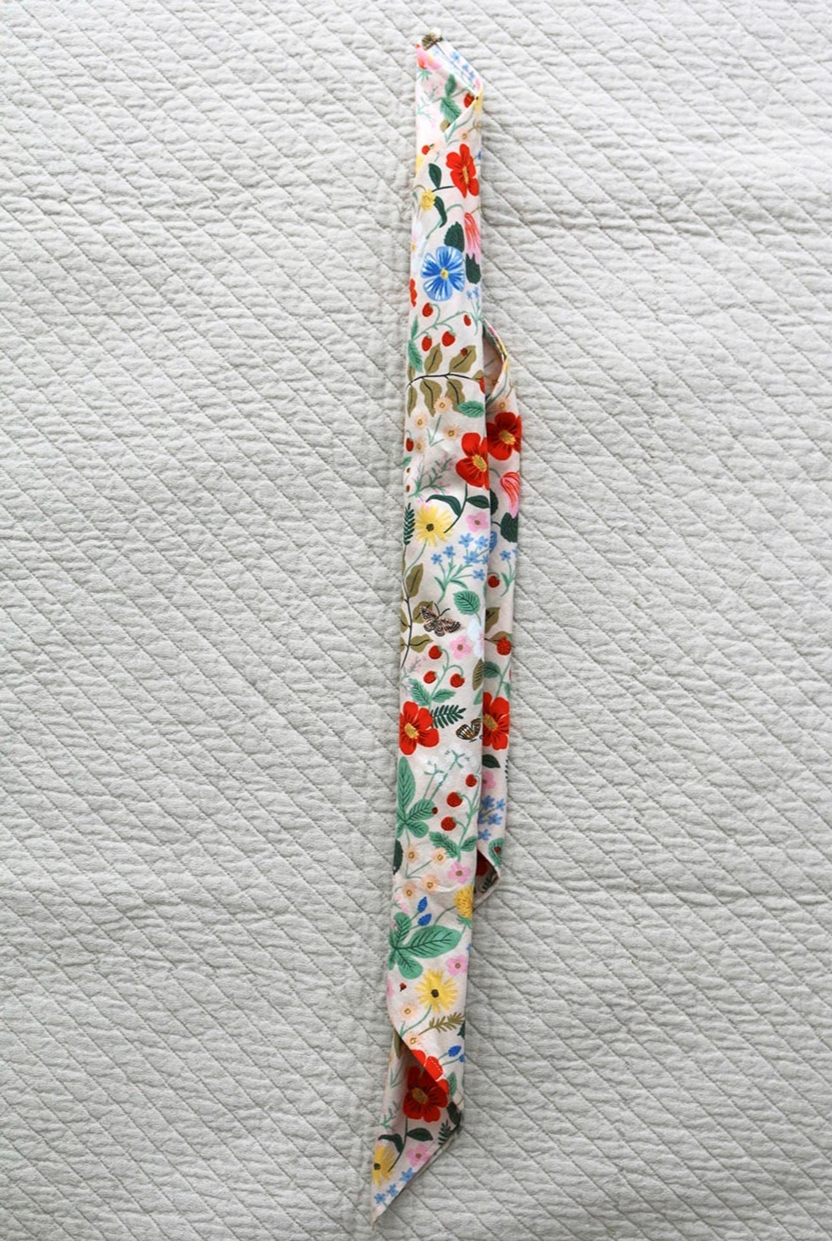 Roll the napkin into a tube.