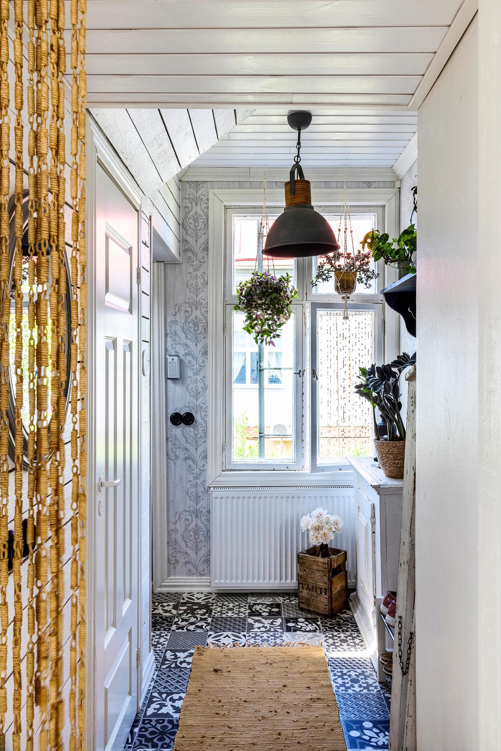 Vinyl flooring that mimics mosaic tiling in the hallway