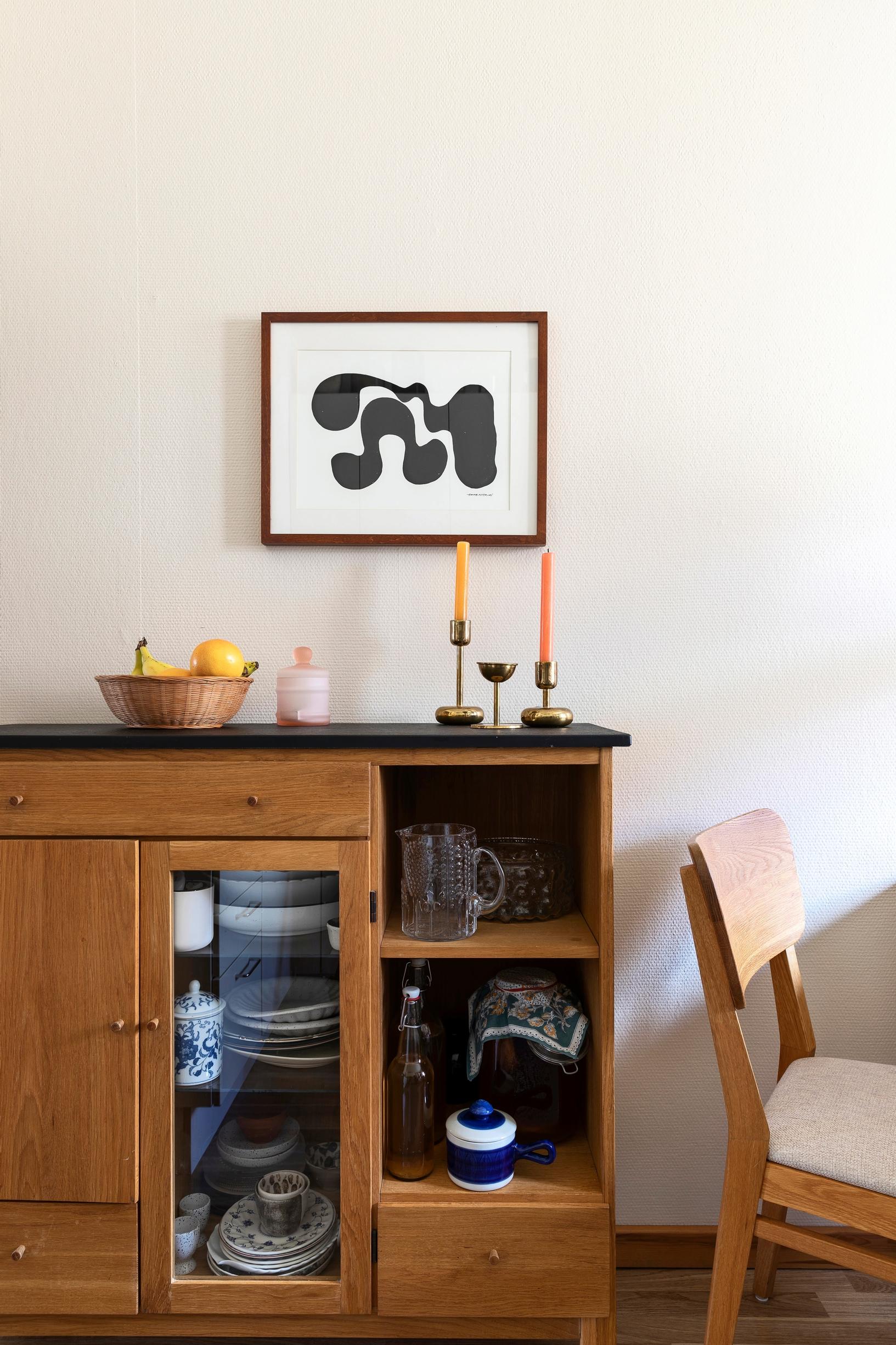 A glass-doored 1950s bookcase repurposed as a dish cabinet.