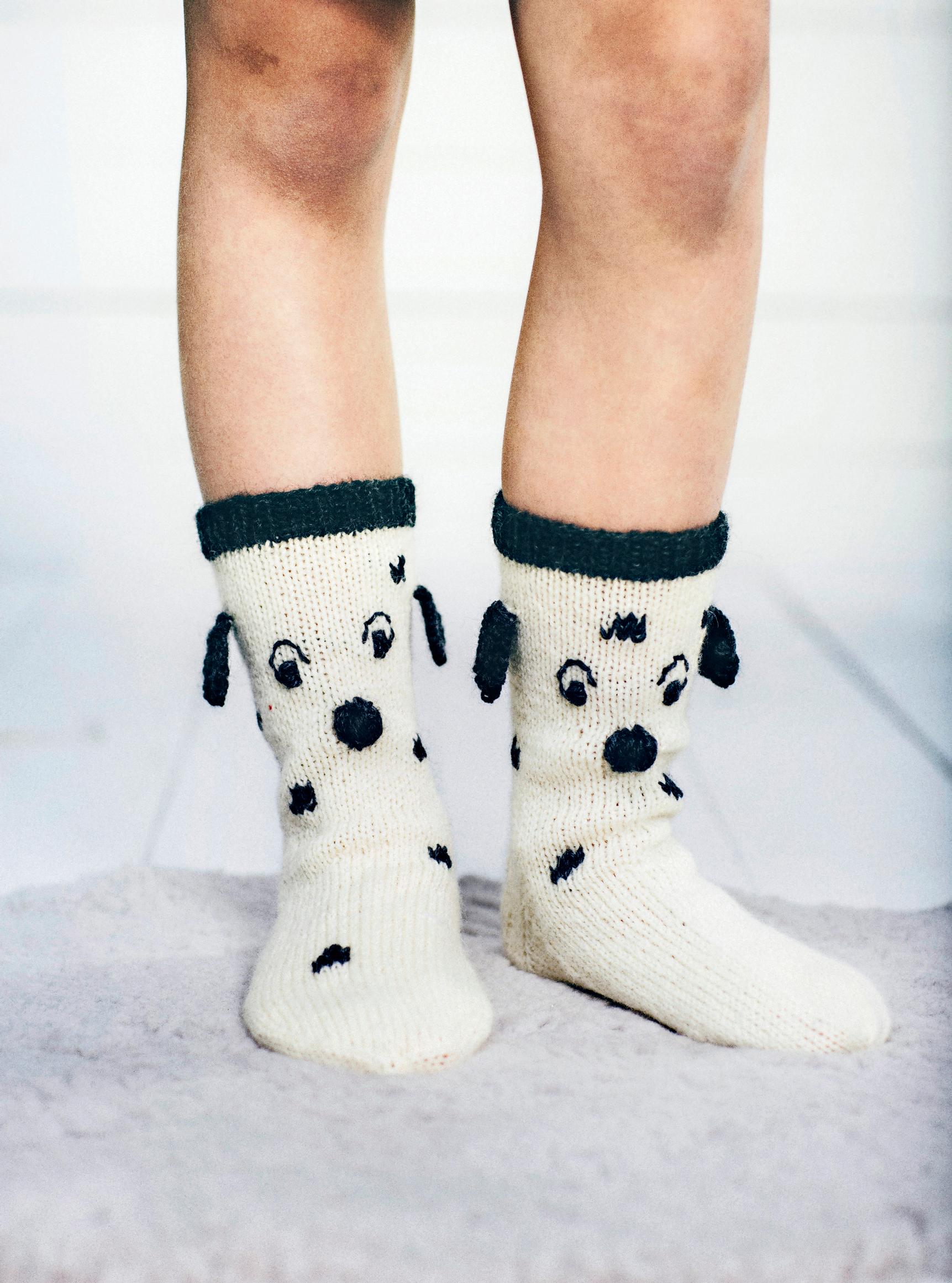 Woof woof! These cheerful Dalmatian wool socks will keep little feet warm