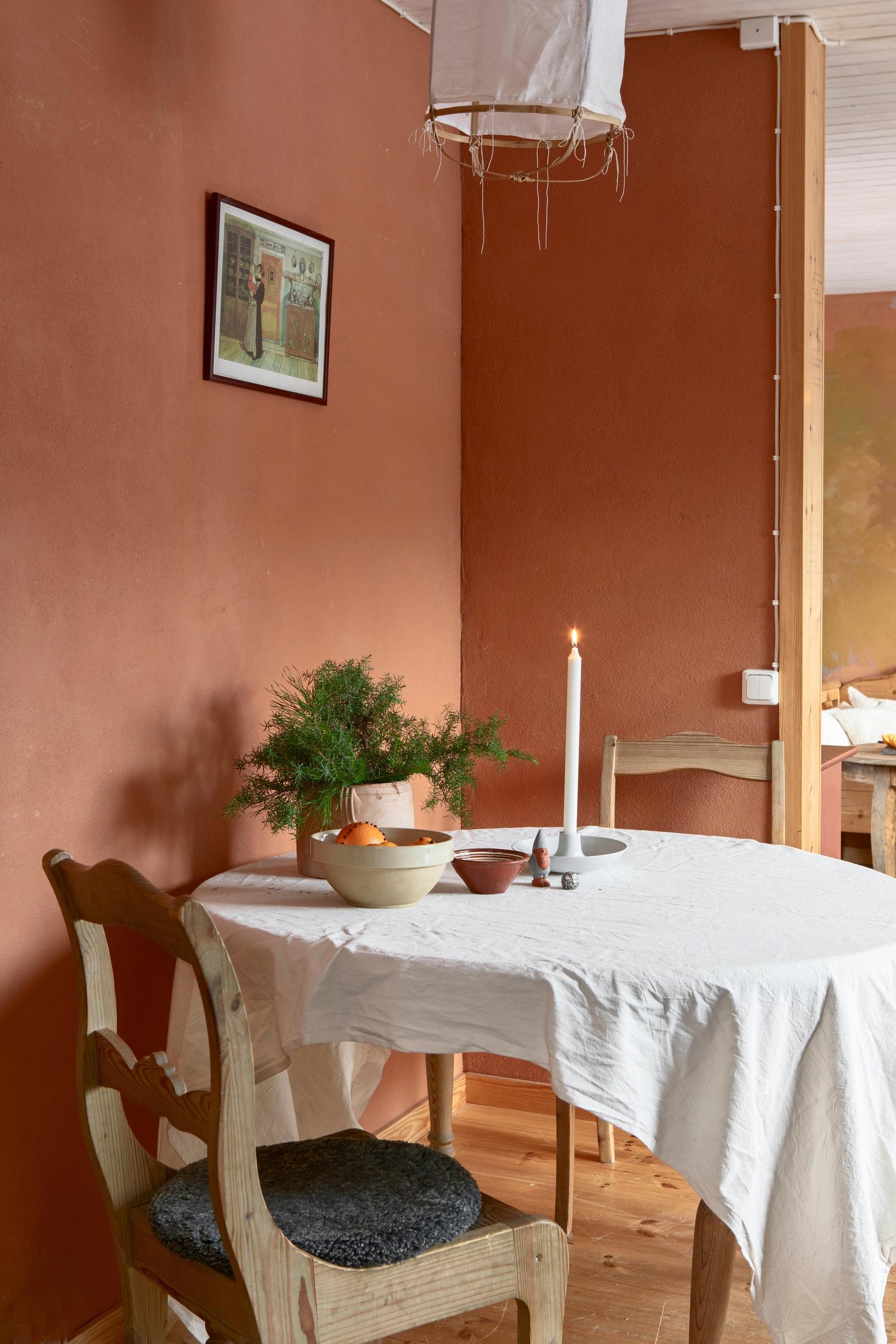 rustic wooden chairs around a round table
