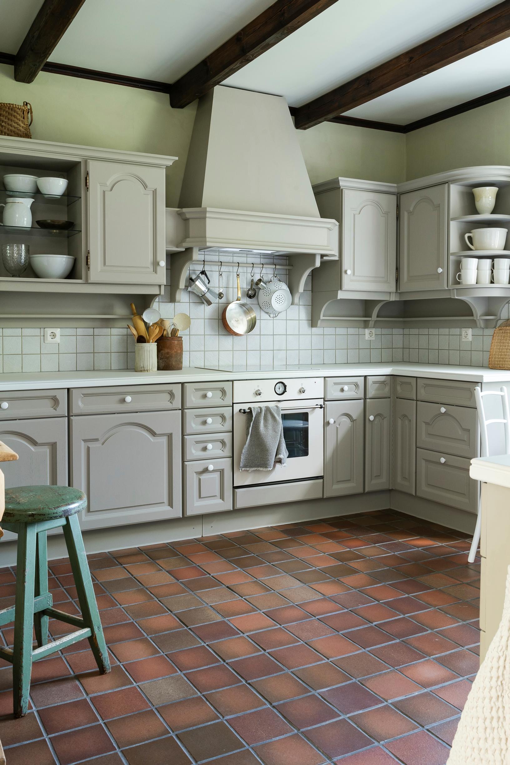The kitchen’s range hood wall after the update.