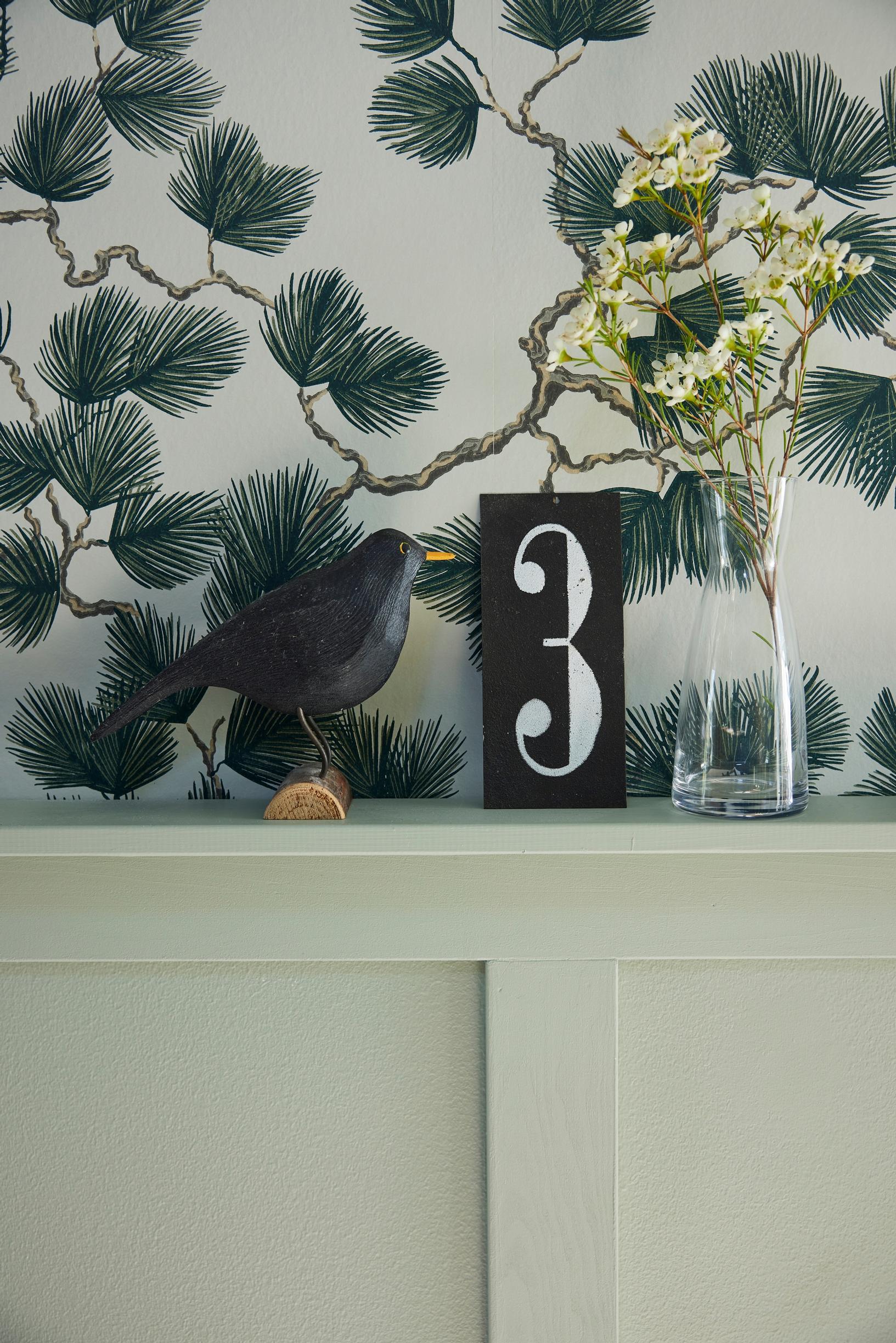 A bird ornament on a shelf