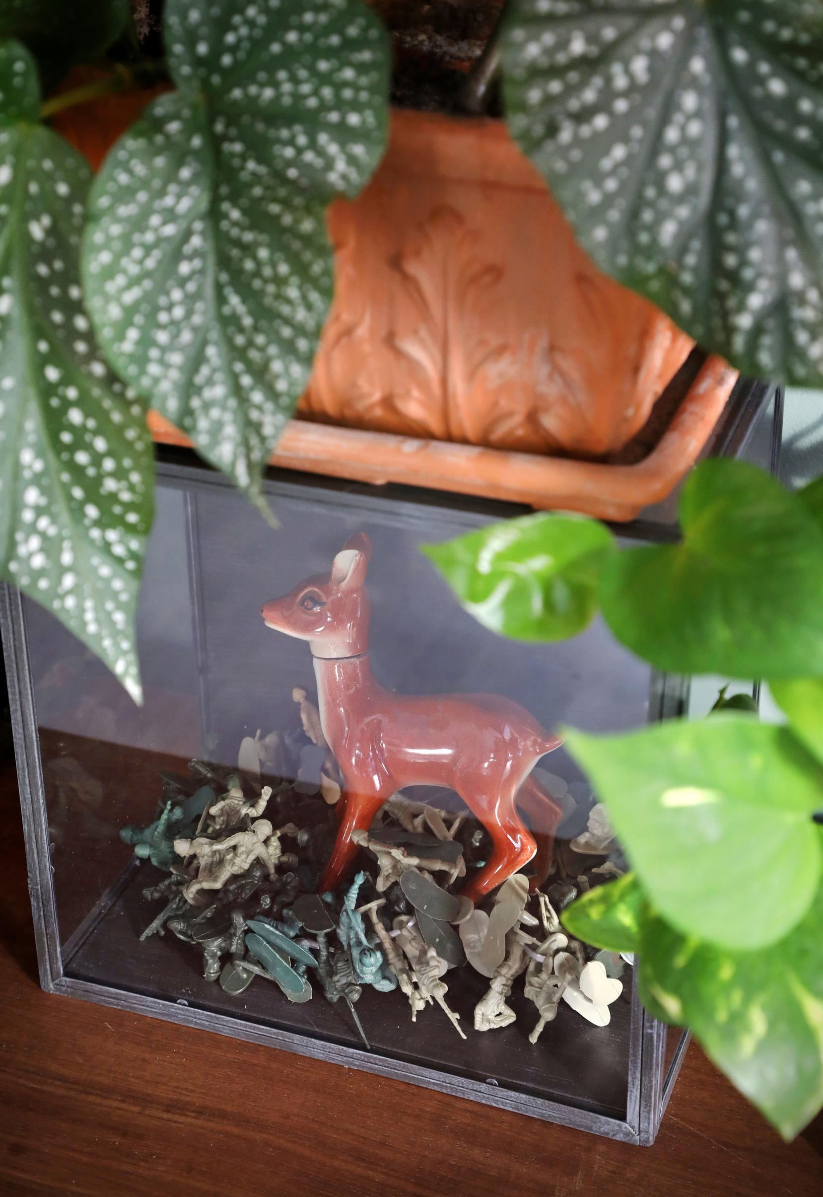 Plastic soldier toys and a deer-shaped bottle