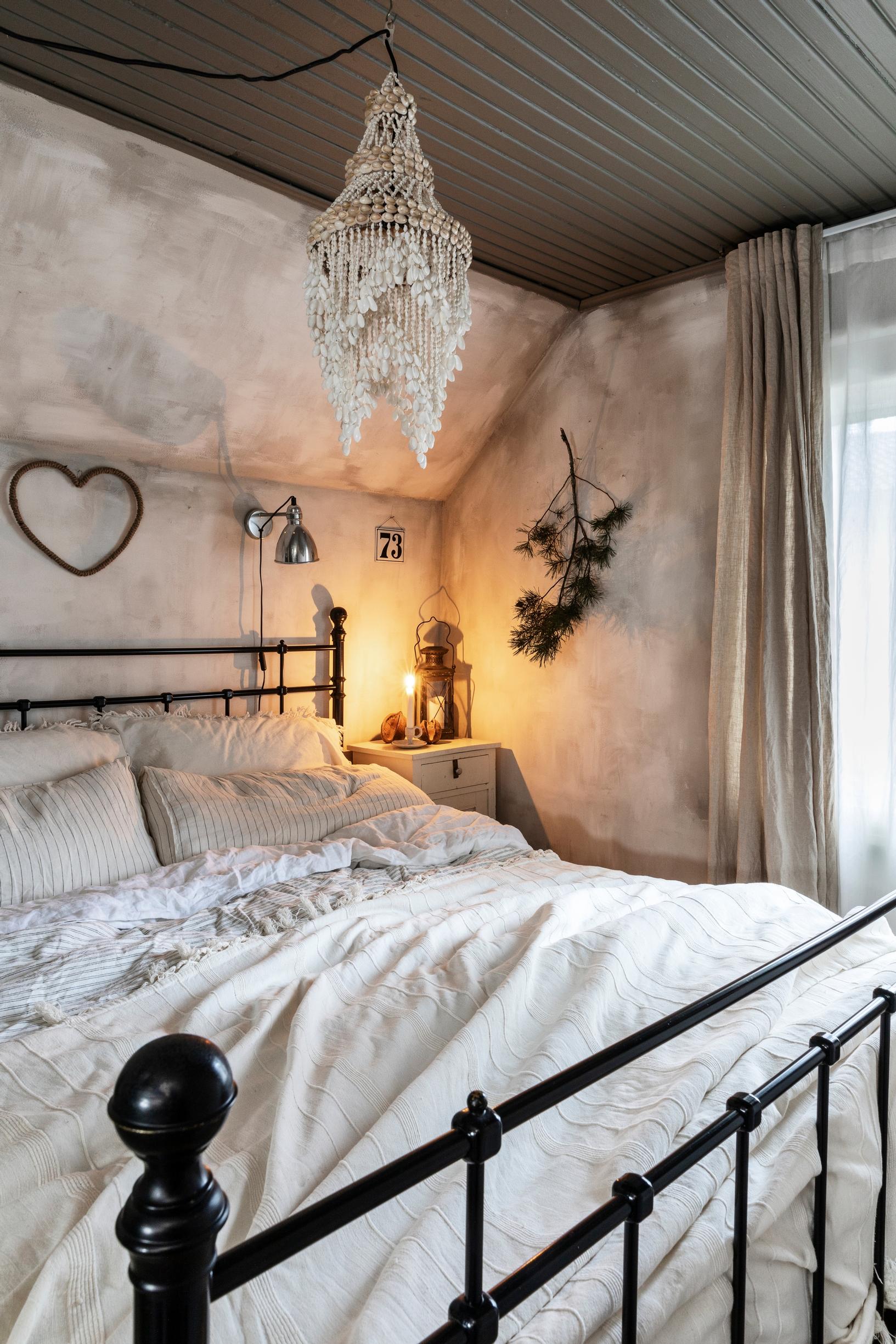 A softly decorated bedroom in an old house
