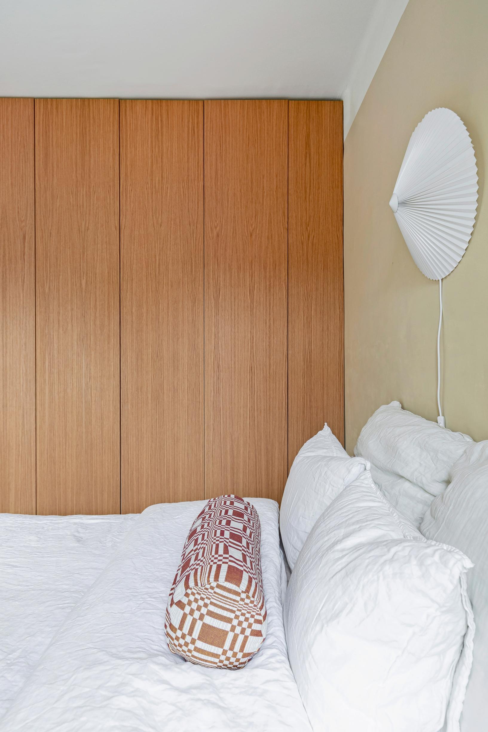 A Johanna Gullichsen Tilkku bolster pillow in the minimalist sleeping area