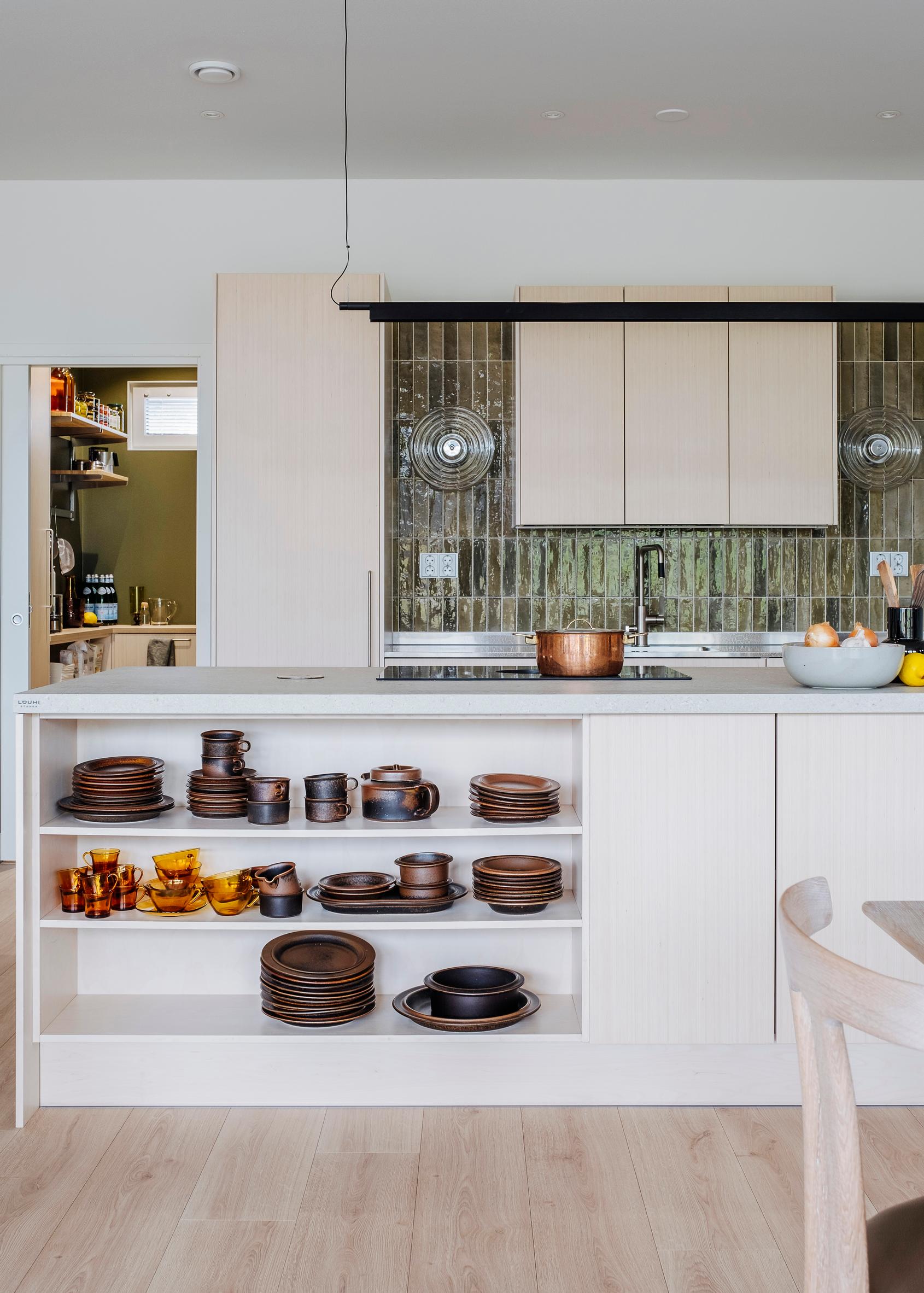 Ruska dishes on an open kitchen island shelf