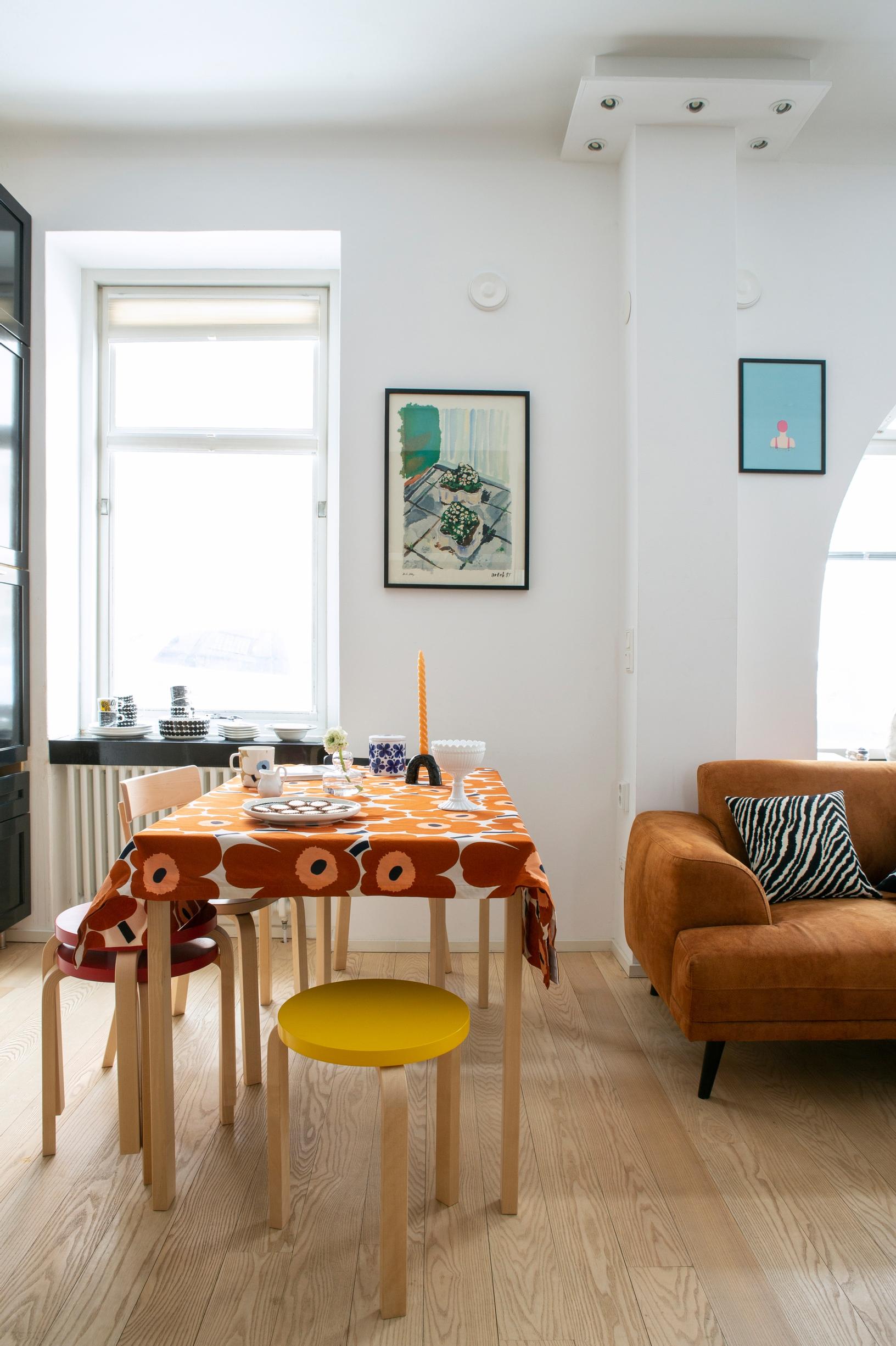 A Marimekko Unikko cloth on an Artek table