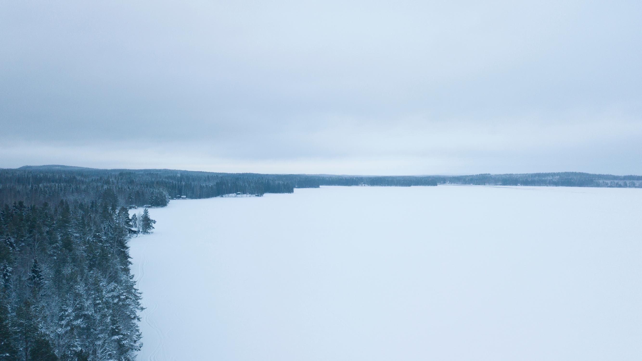 An aerial view of the frozen lake in winter.