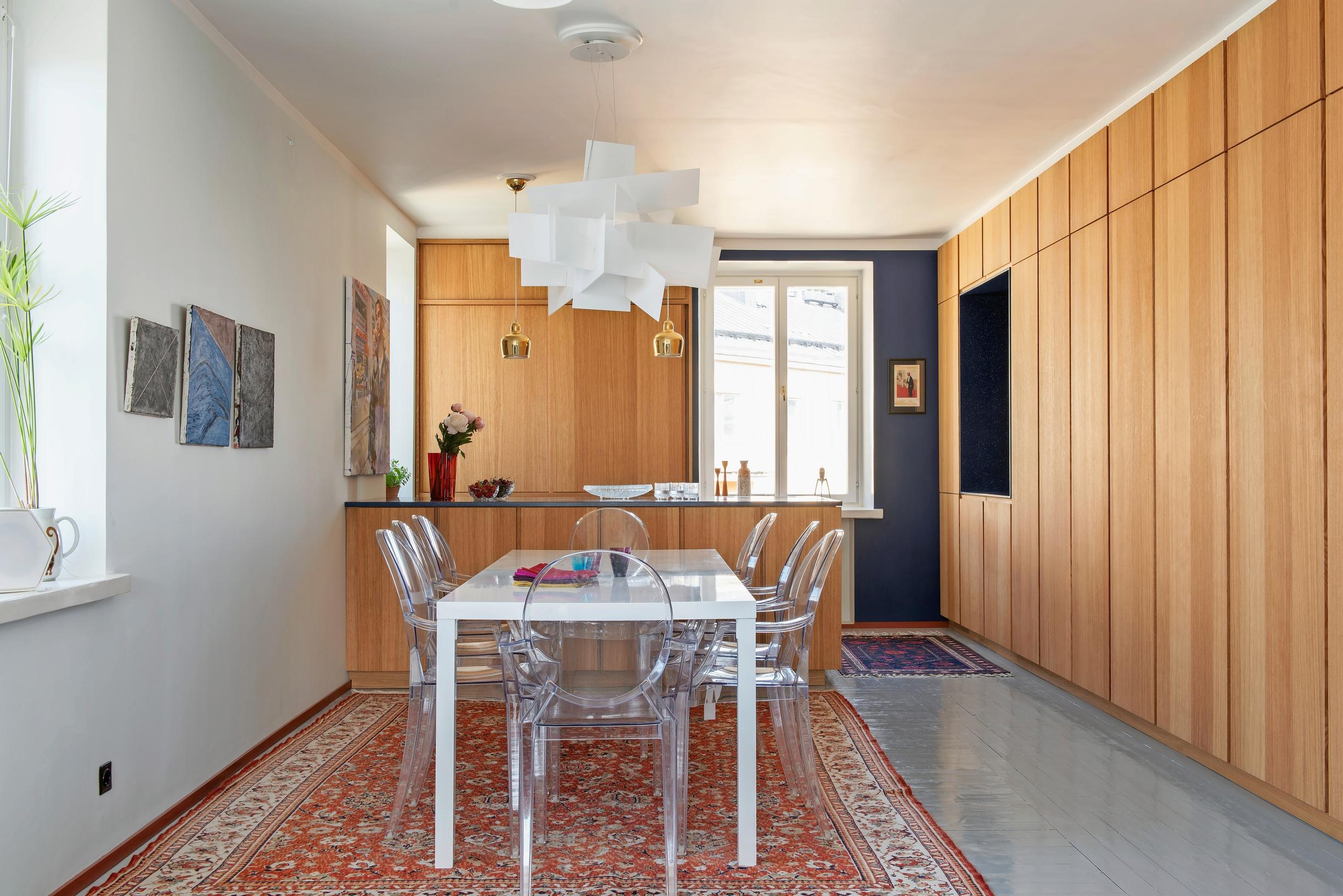 A large, bright kitchen-dining area with oak cabinetry in the background.