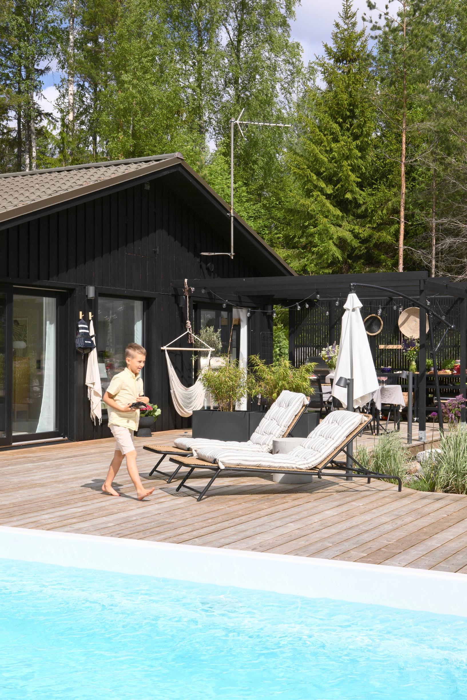 Swimming pool and sun loungers on the deck