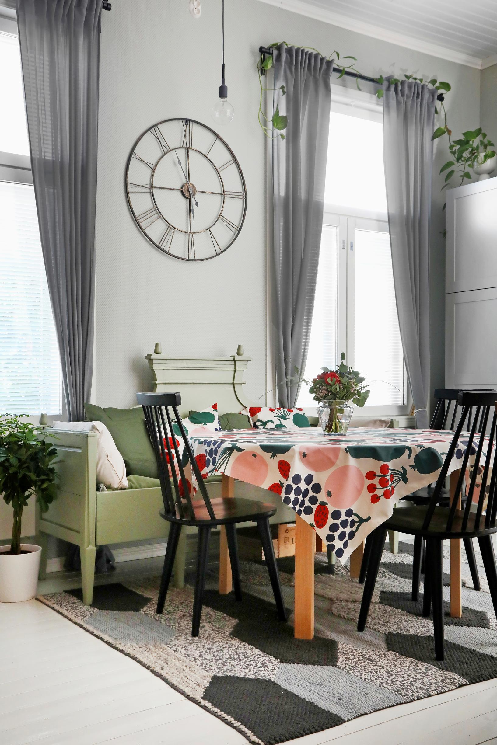 Wooden sofa and wall clock in the dining area