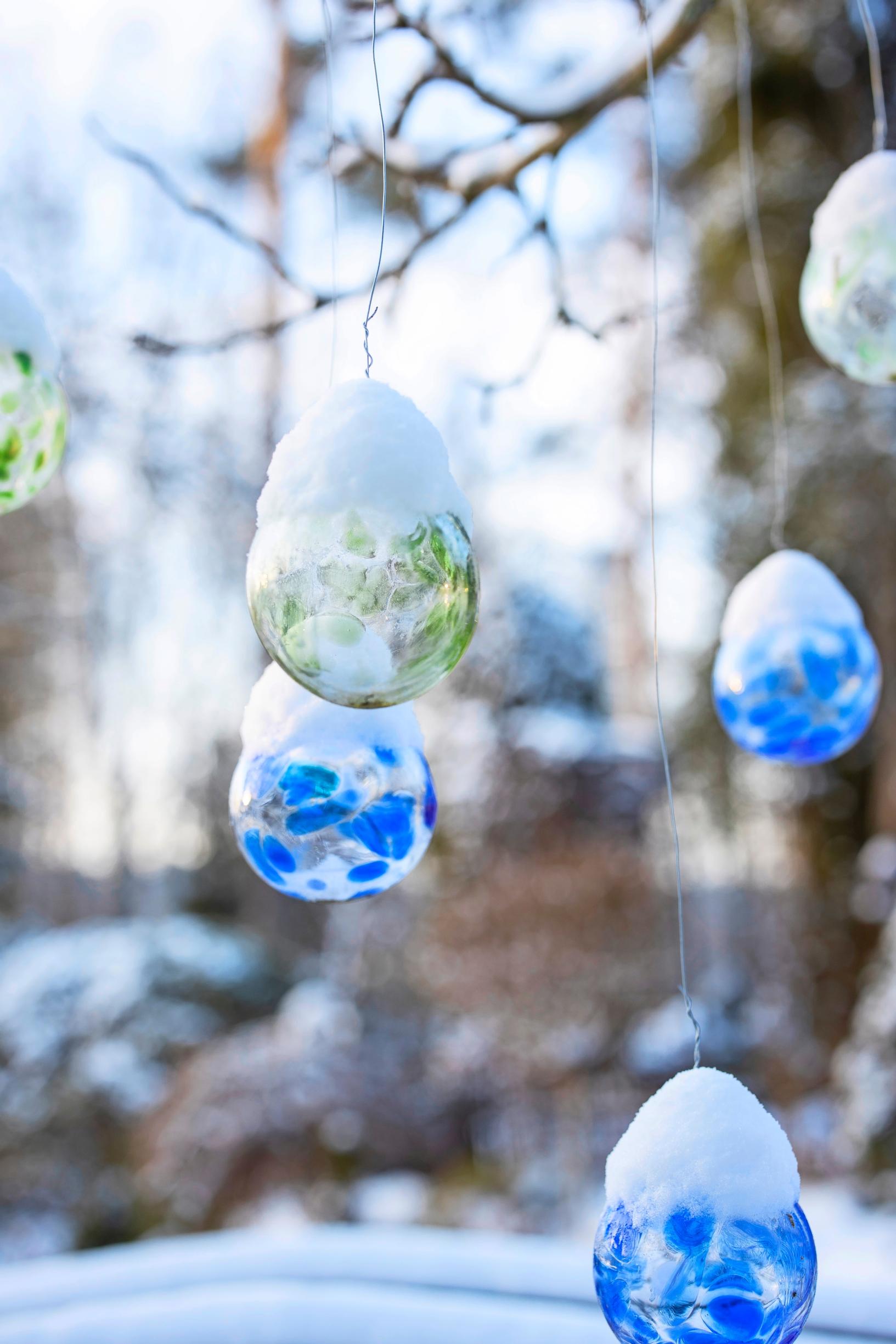 The blown glass balls remain in place year-round.
