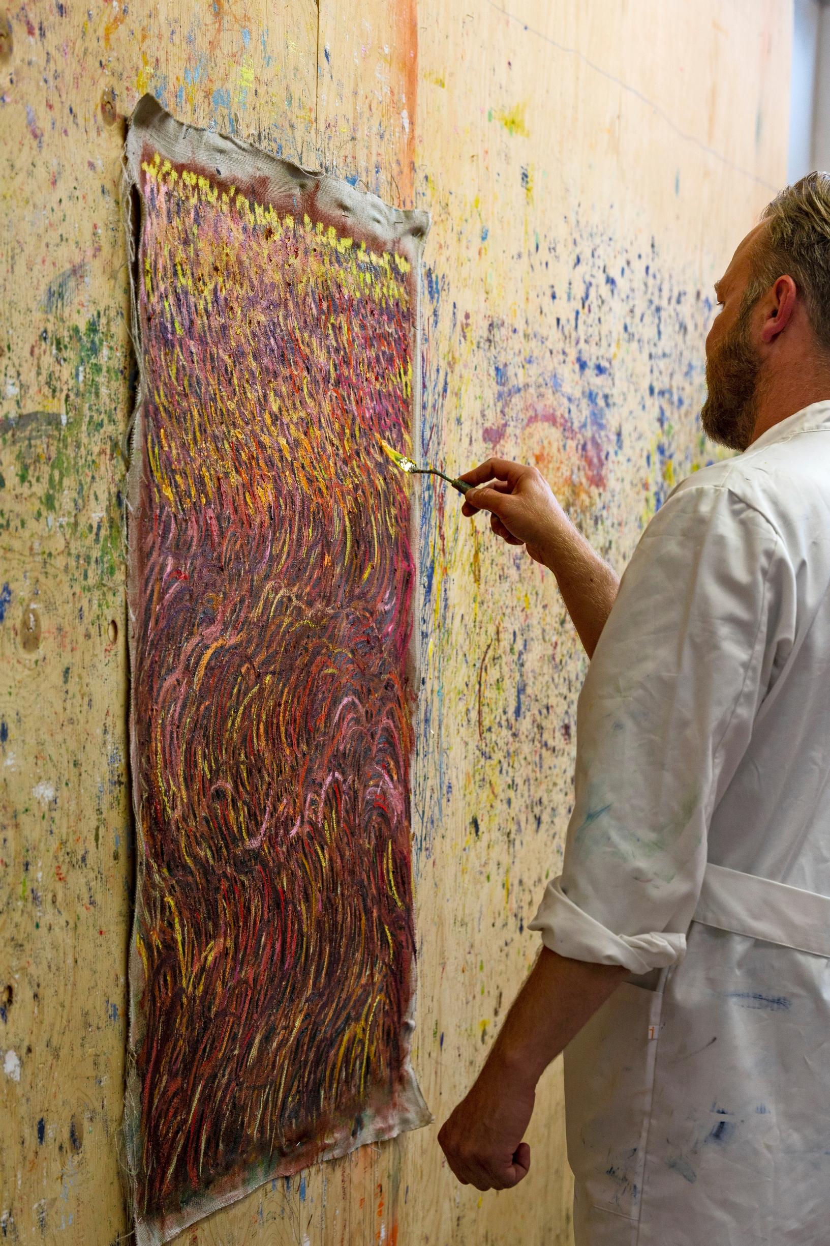 Eemil Karila painting a canvas