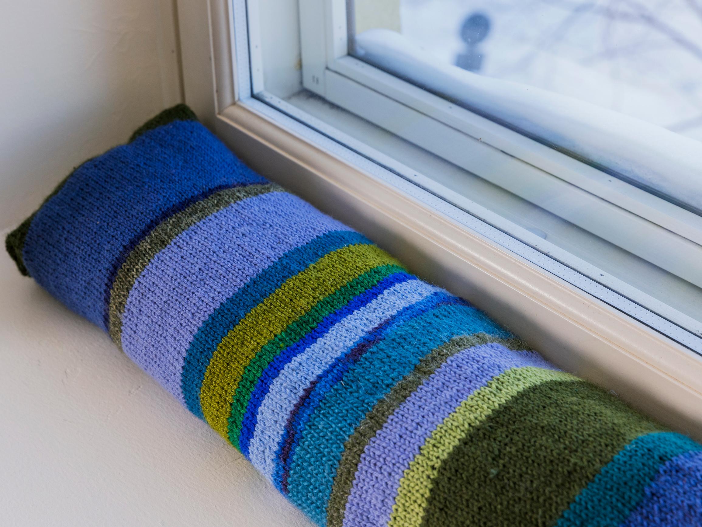 Defeat drafts with a fun draft stopper—easy to knit from scrap yarn