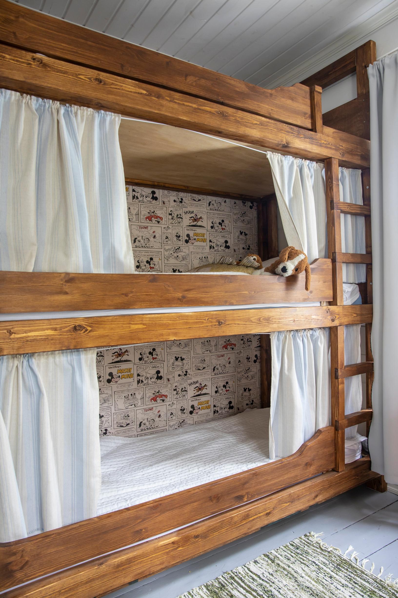 A three-tier wooden bunk bed
