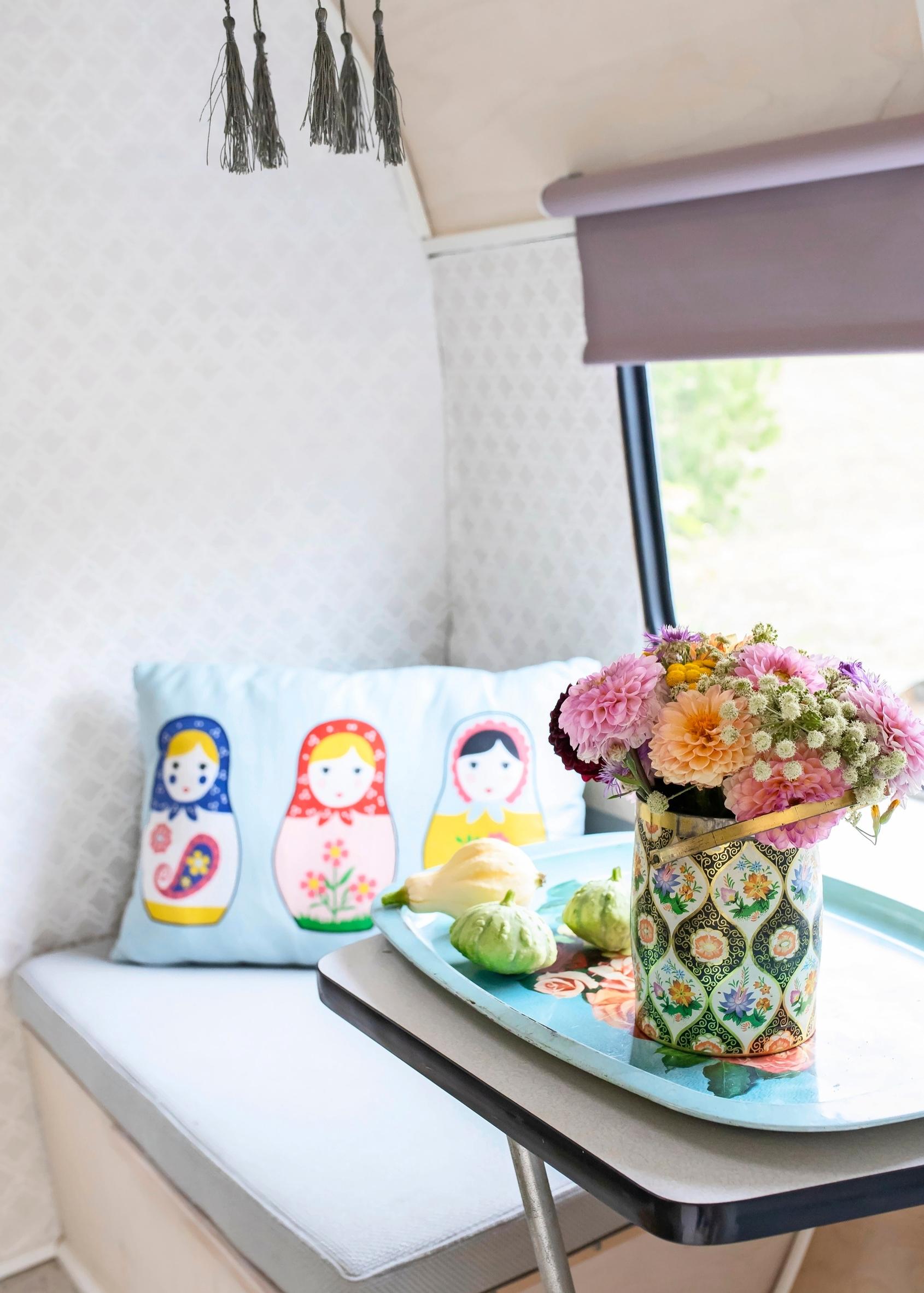 Caravan interior decor, vase and throw pillow