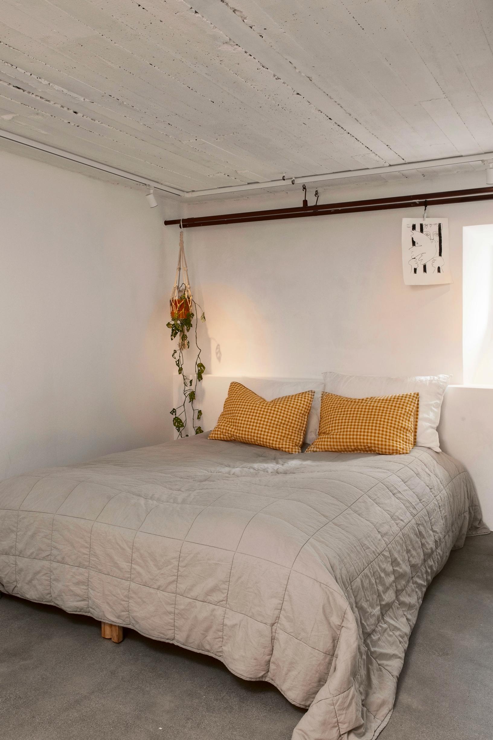 A light-filled bedroom in the cellar.