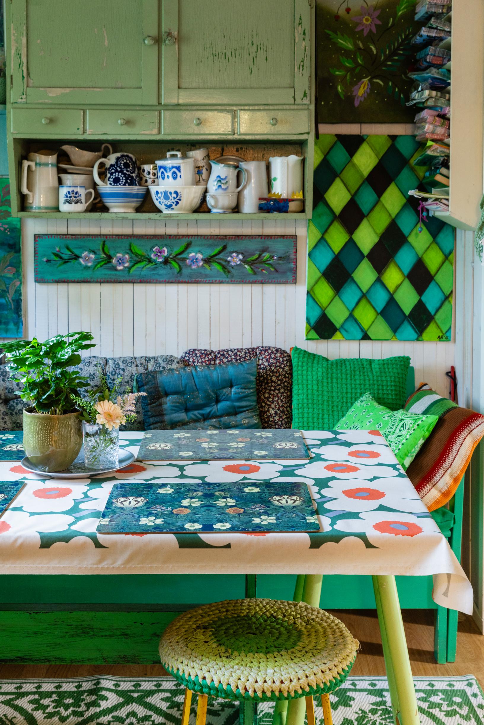 Green‑hued kitchen seating area