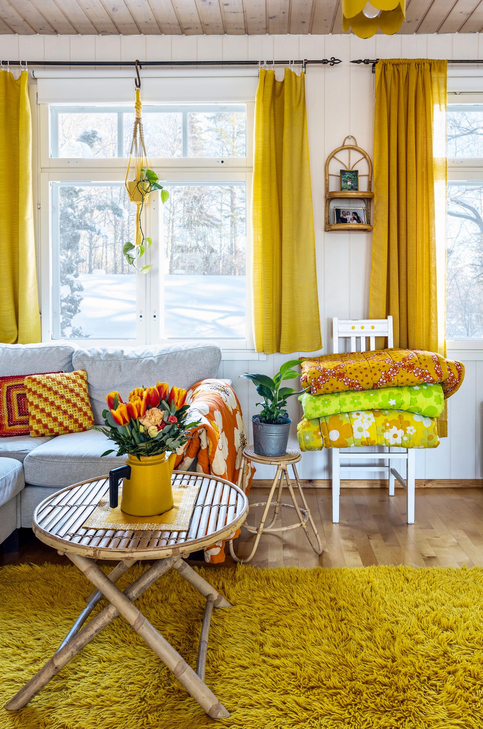 The Luomaranta living room, filled with vintage quilts and a Pehtoori pot.