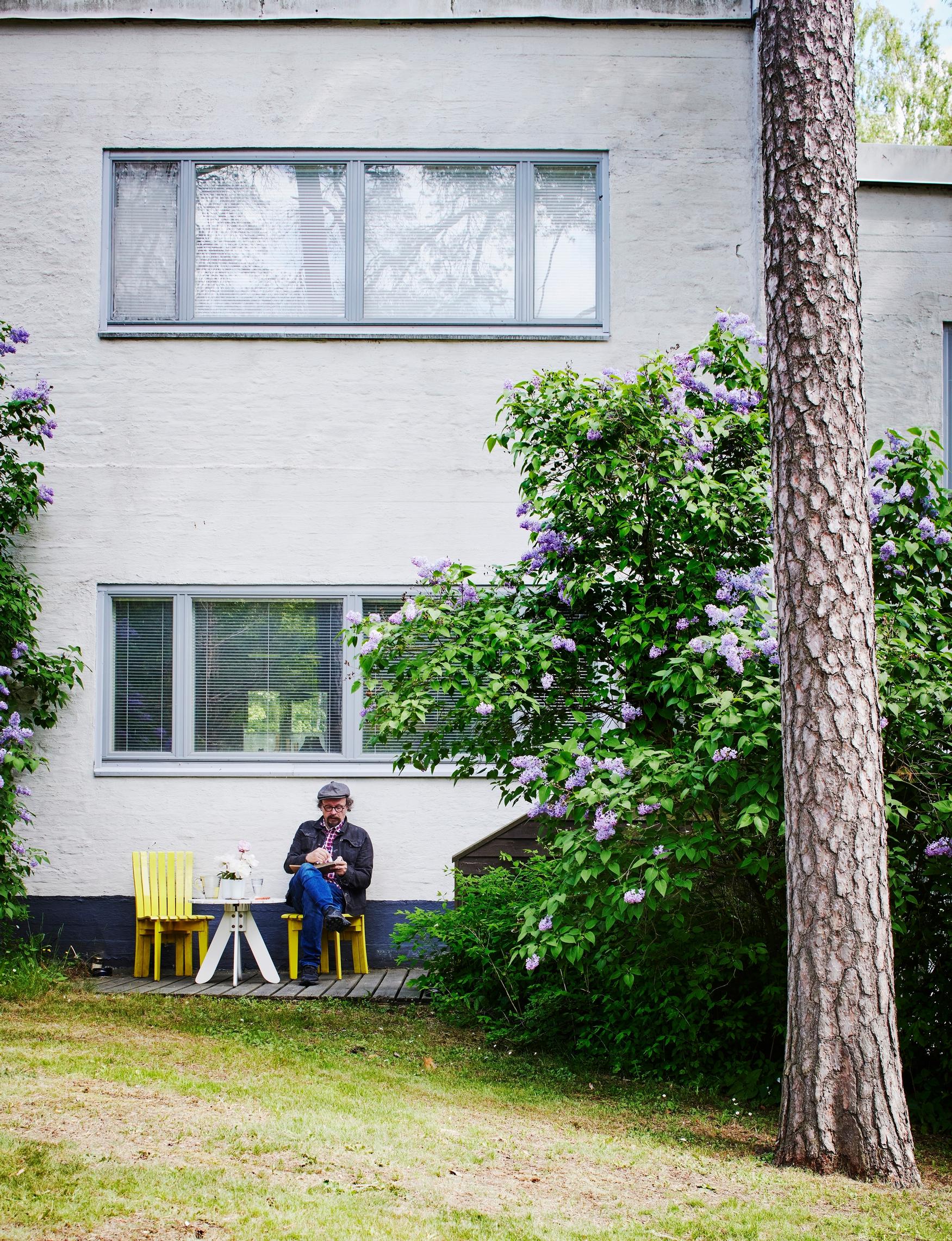 Karri often sits drawing in front of his house