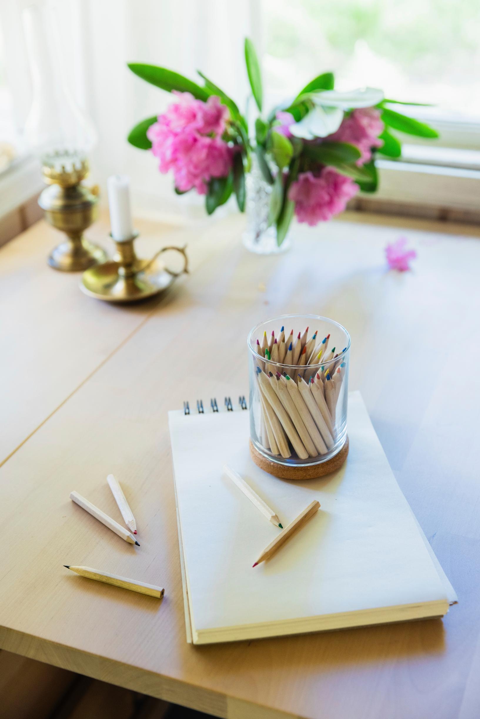 pencils and paper on a table
