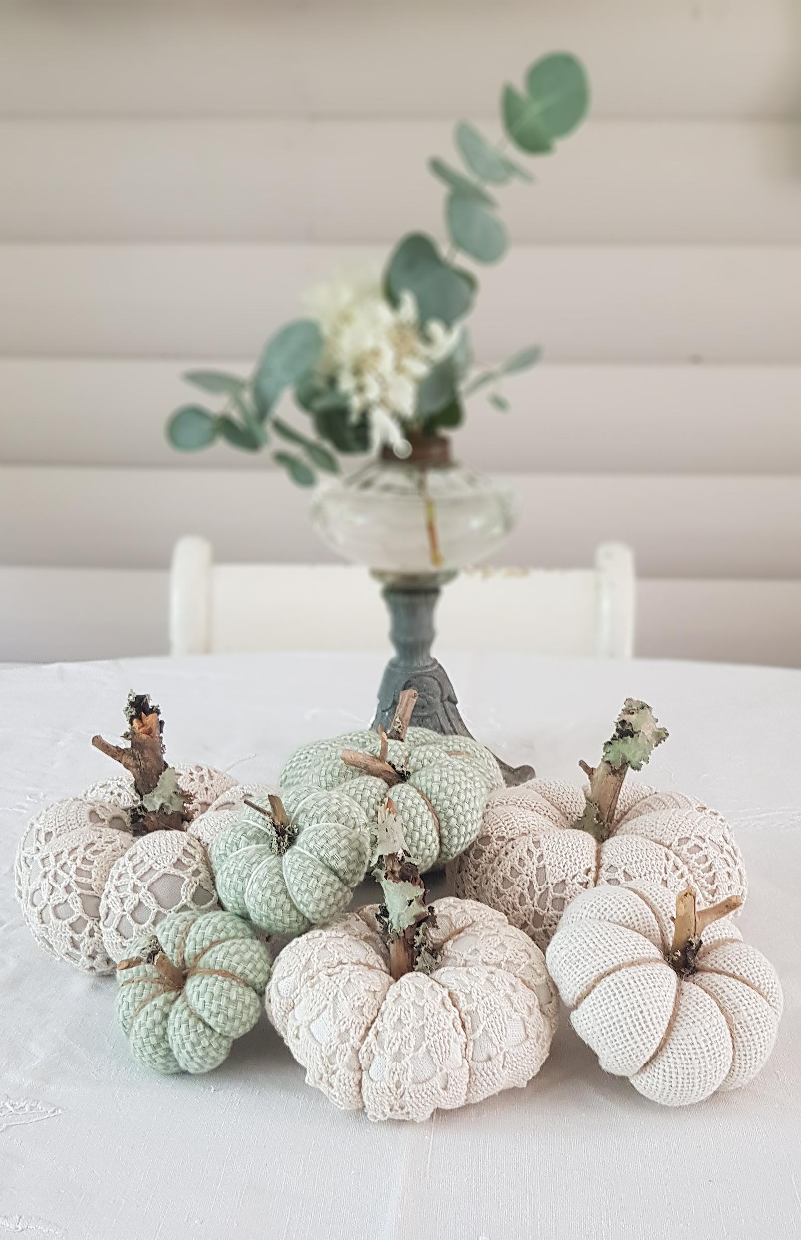 Soft off-white and green tones suit these fabric pumpkins.