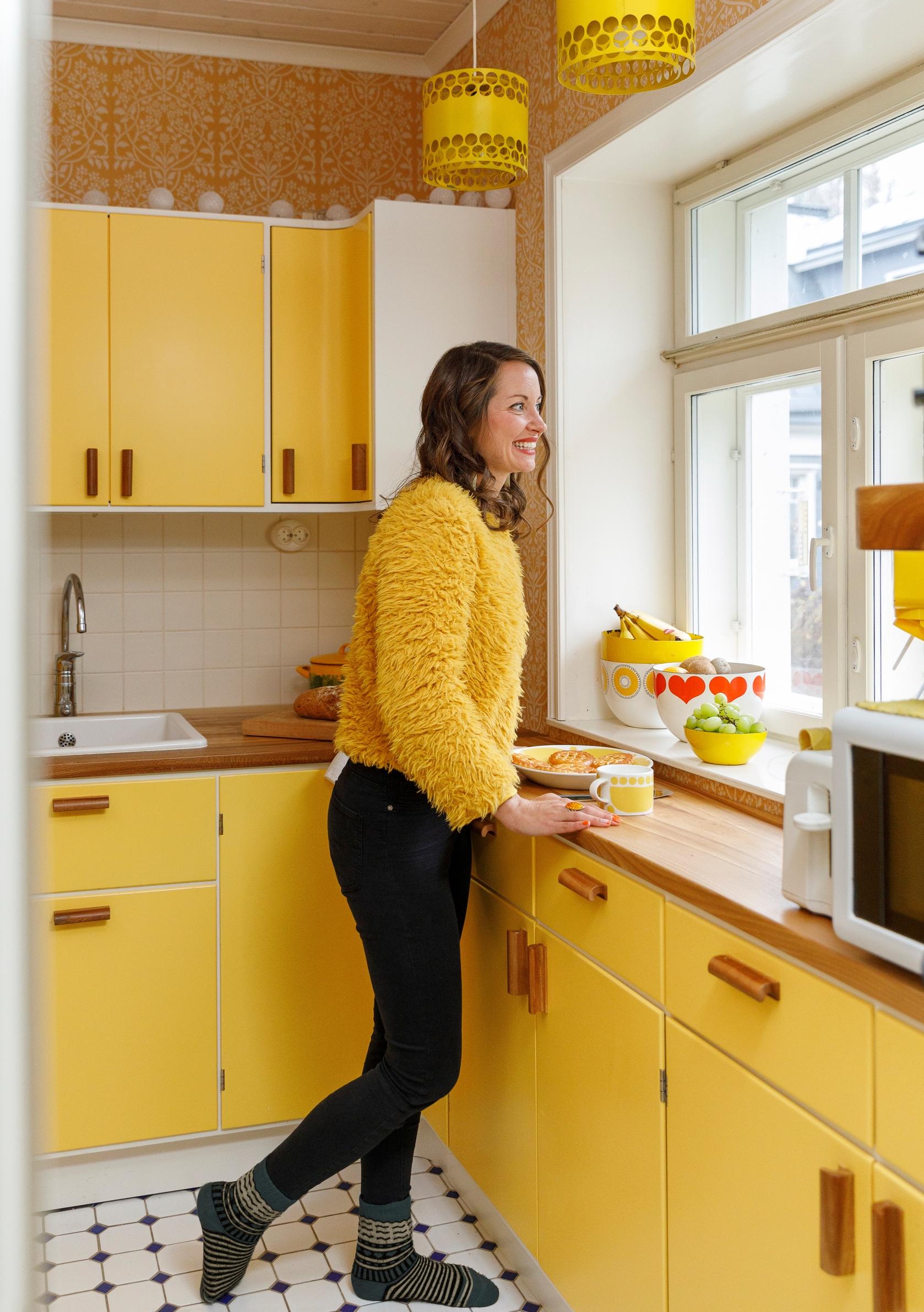 Elisa Luomaranta in her yellow kitchen
