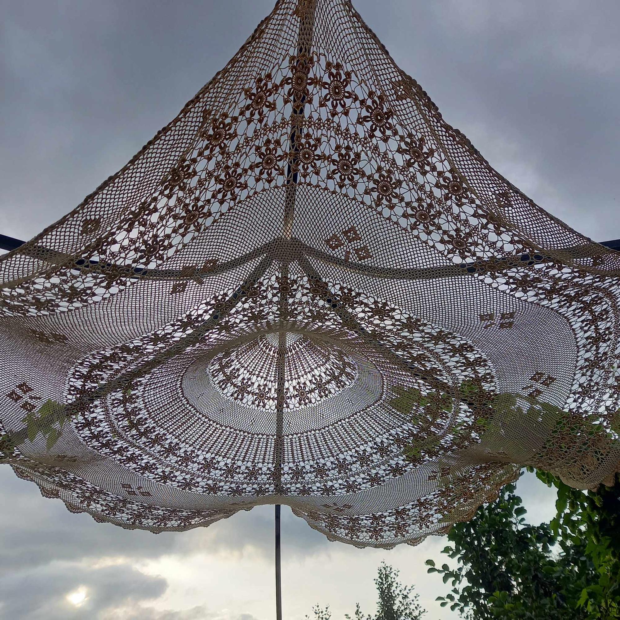 The doily’s pattern stands out beautifully against the light.