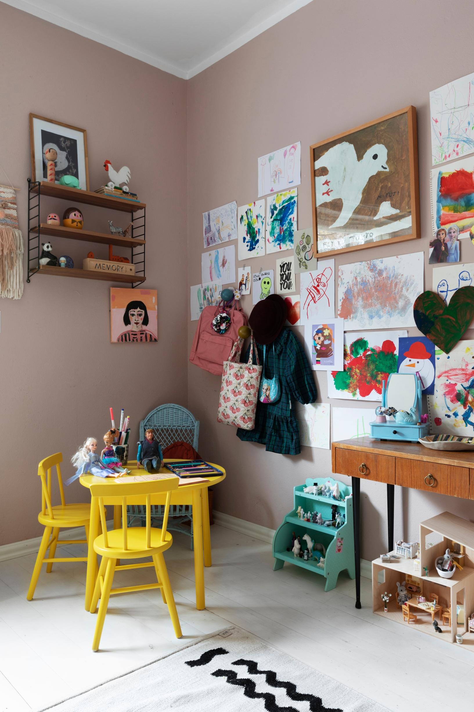 In the children’s room, a small yellow table and spindle chairs by Hakola