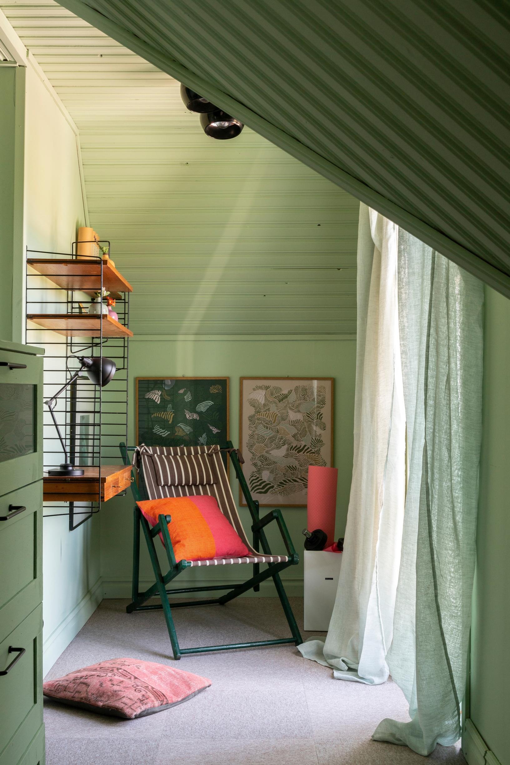 A cozy corner in the bedroom, featuring a French balcony with double doors.