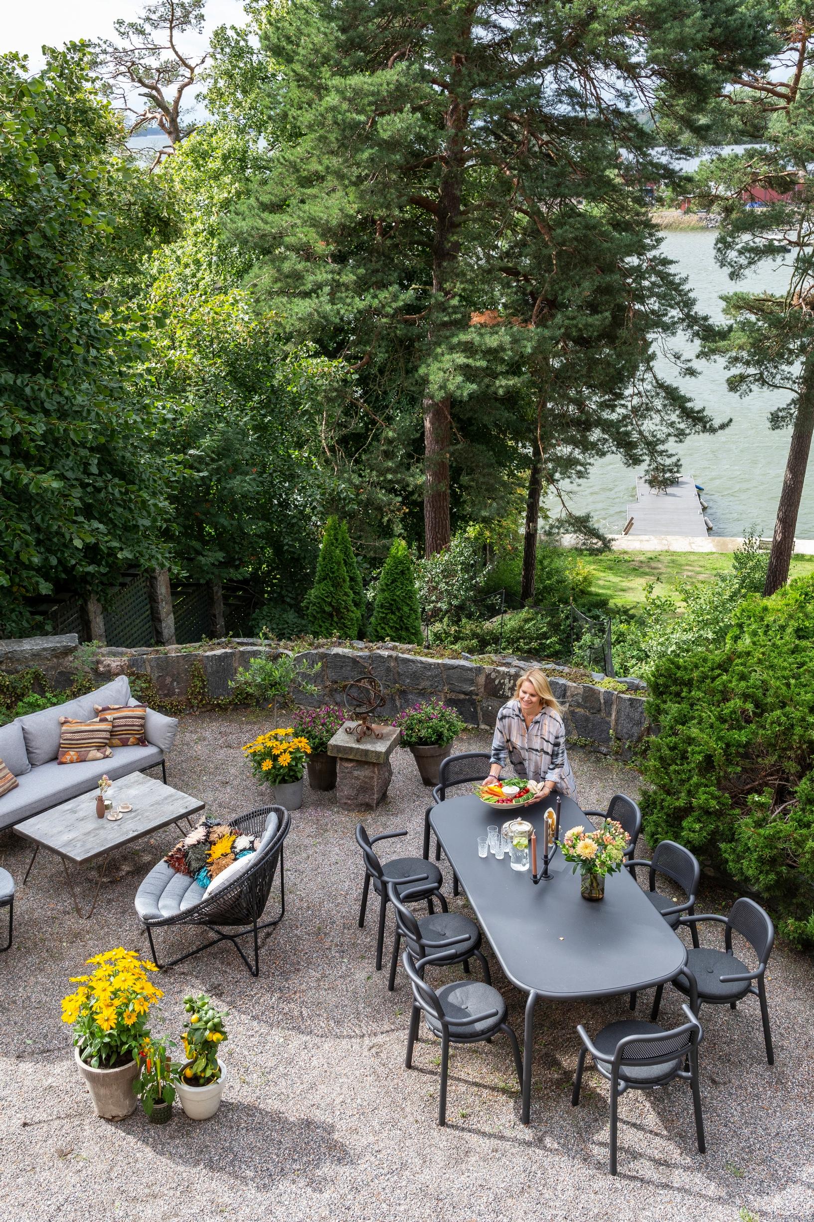 A minimalist dining set on a single-family home's terrace