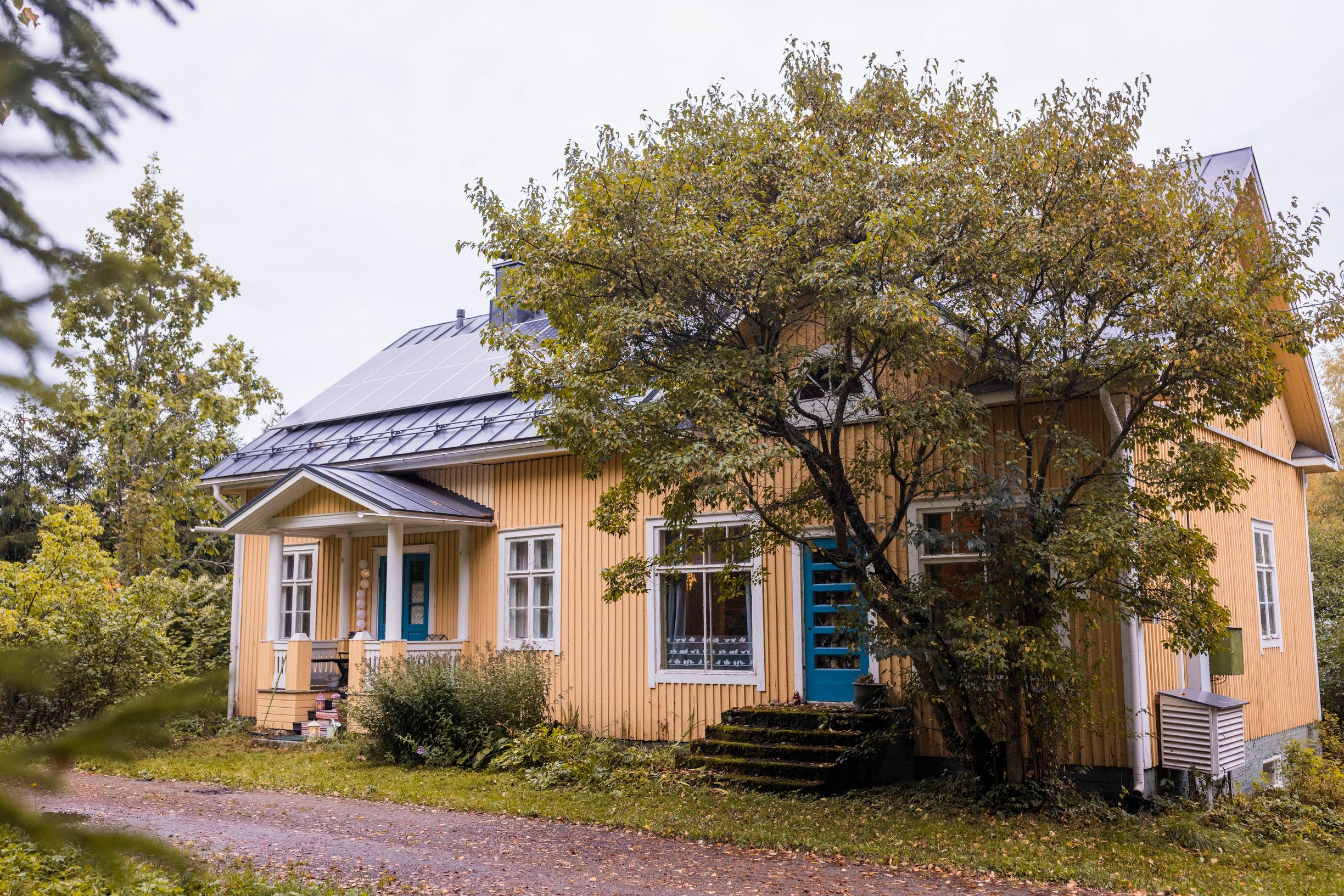 A yellow wooden house, once an old shop
