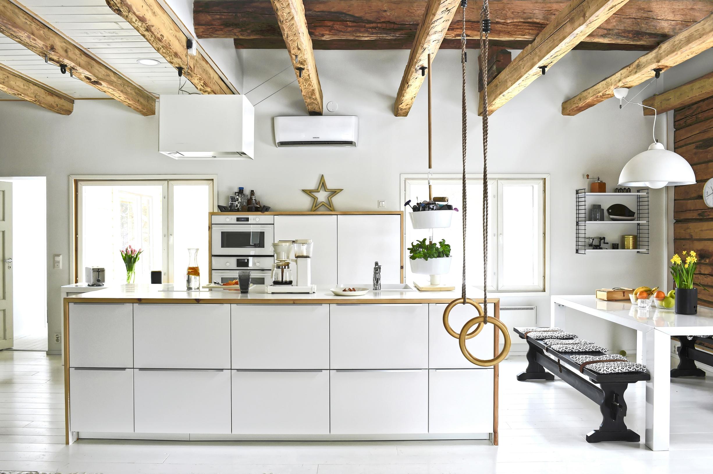 A renovated white kitchen in an old house