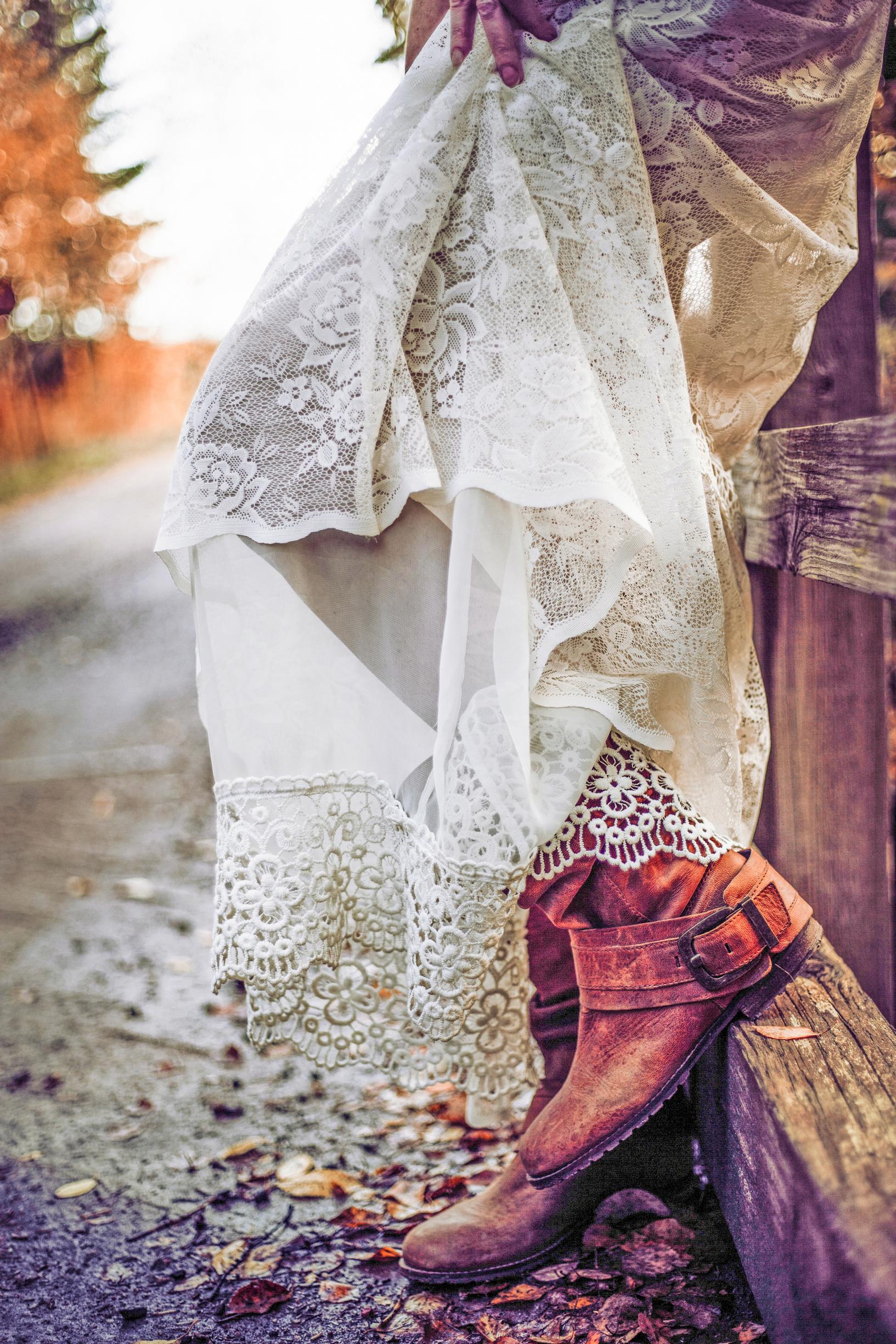 A photo of a lace gown’s hem.