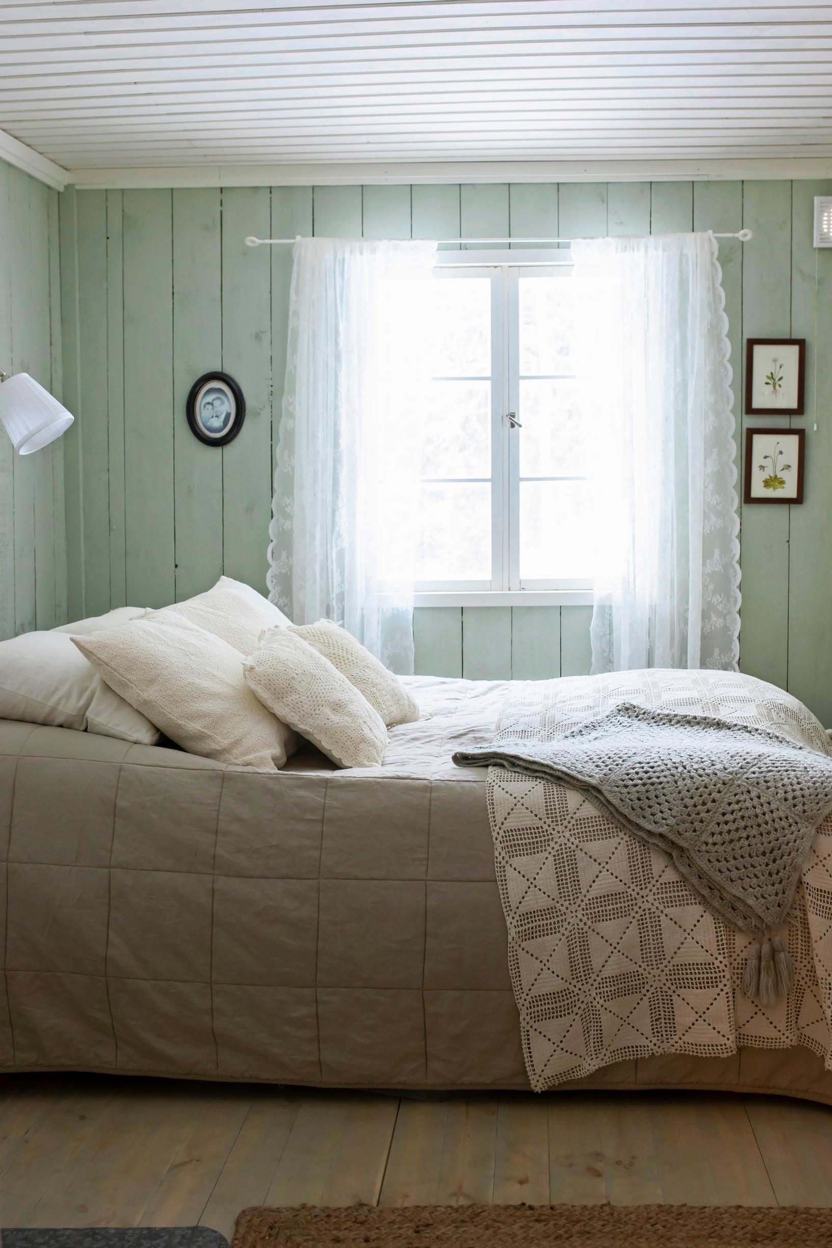 Bedroom walls paneled with finely sawn boards