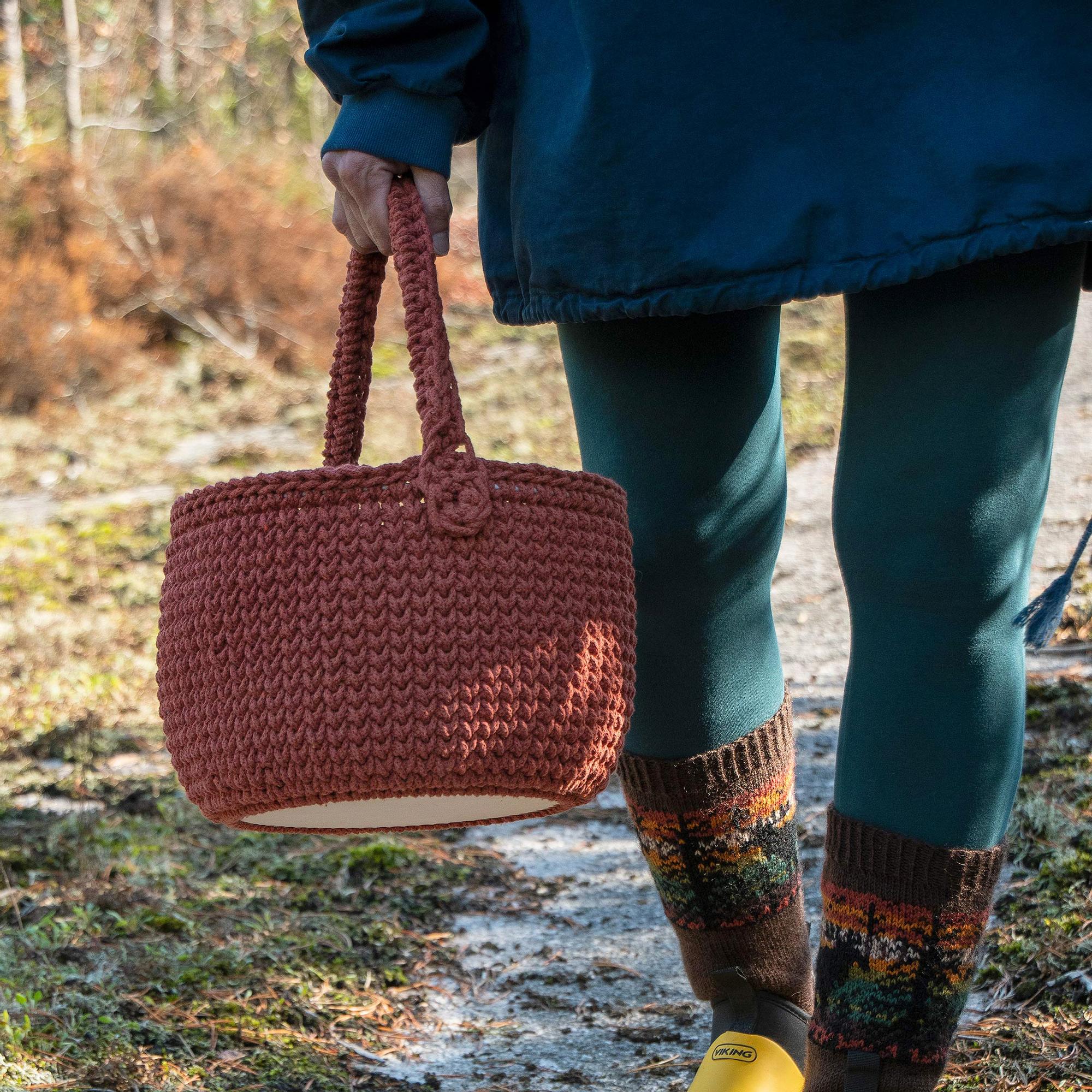 Crocheted picnic basket with a sturdy handle and plywood base—make it and take it anywhere!