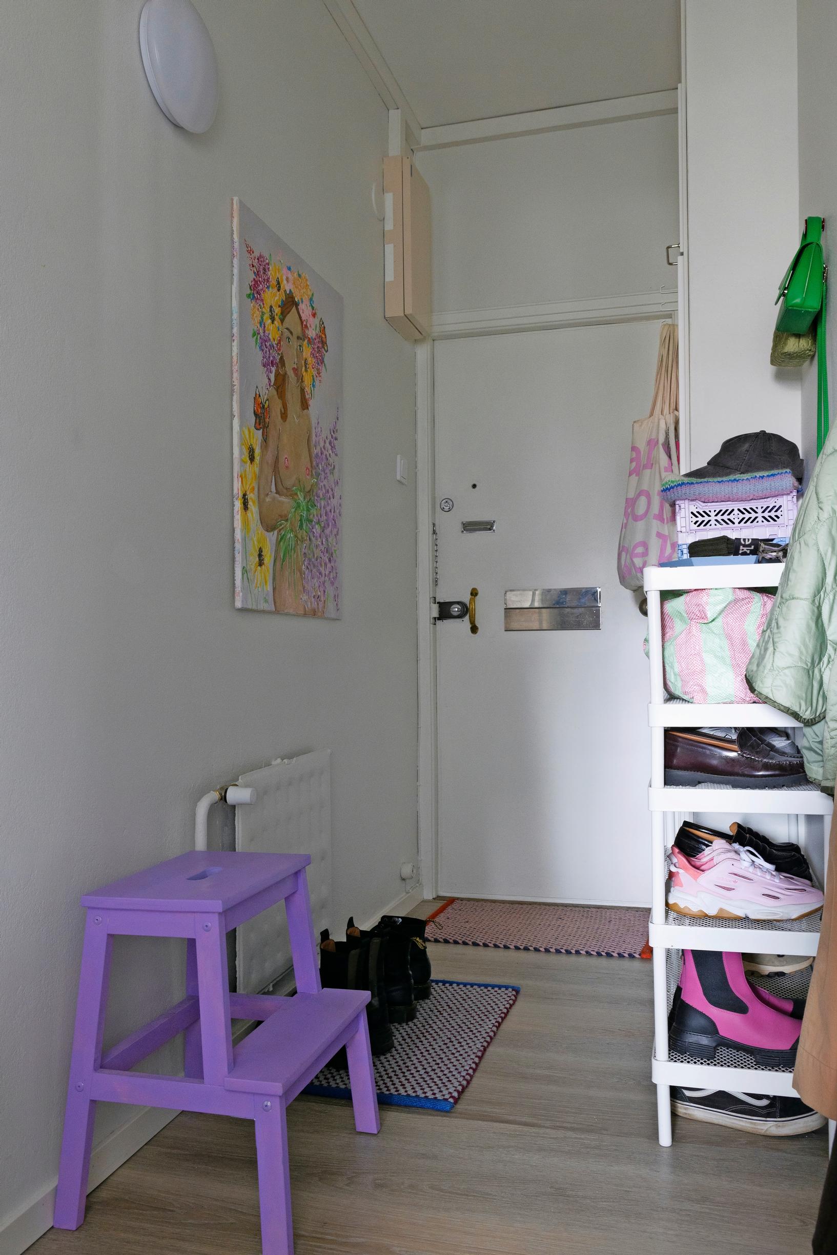 Lavender-painted stool in the entryway