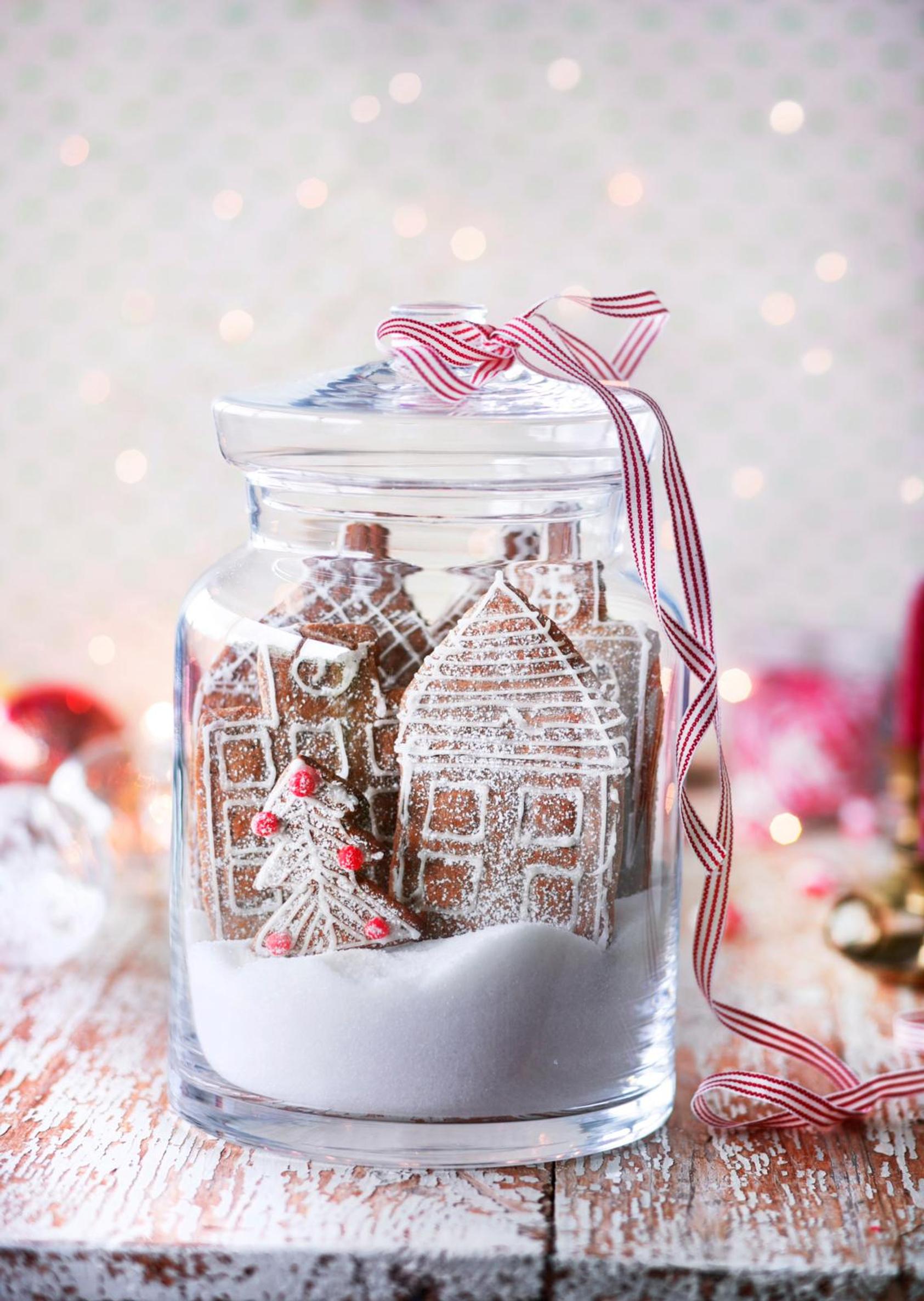 A glass jar filled with gingerbread cookies