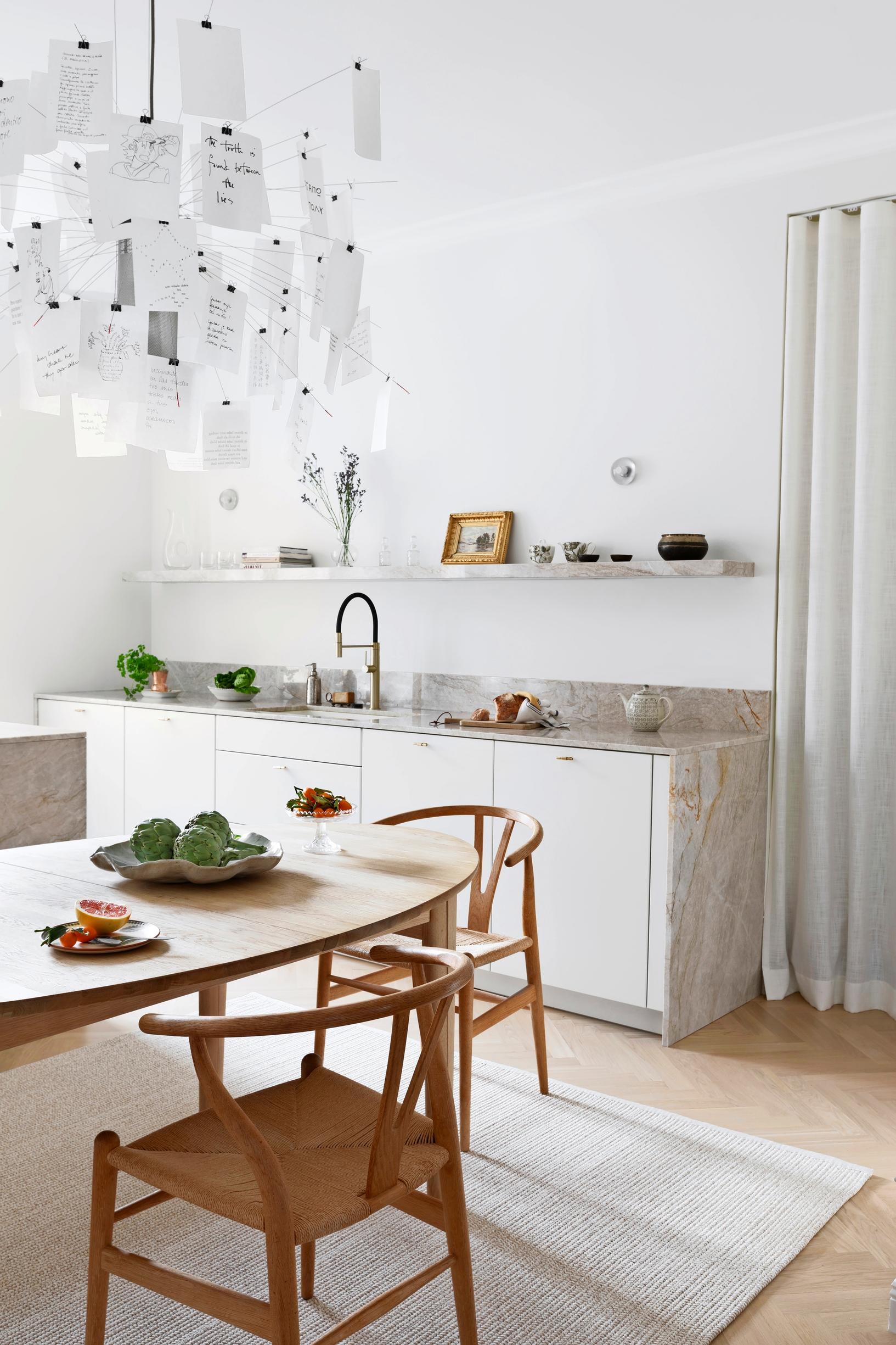 A spacious and naturally toned kitchen without upper cabinets.