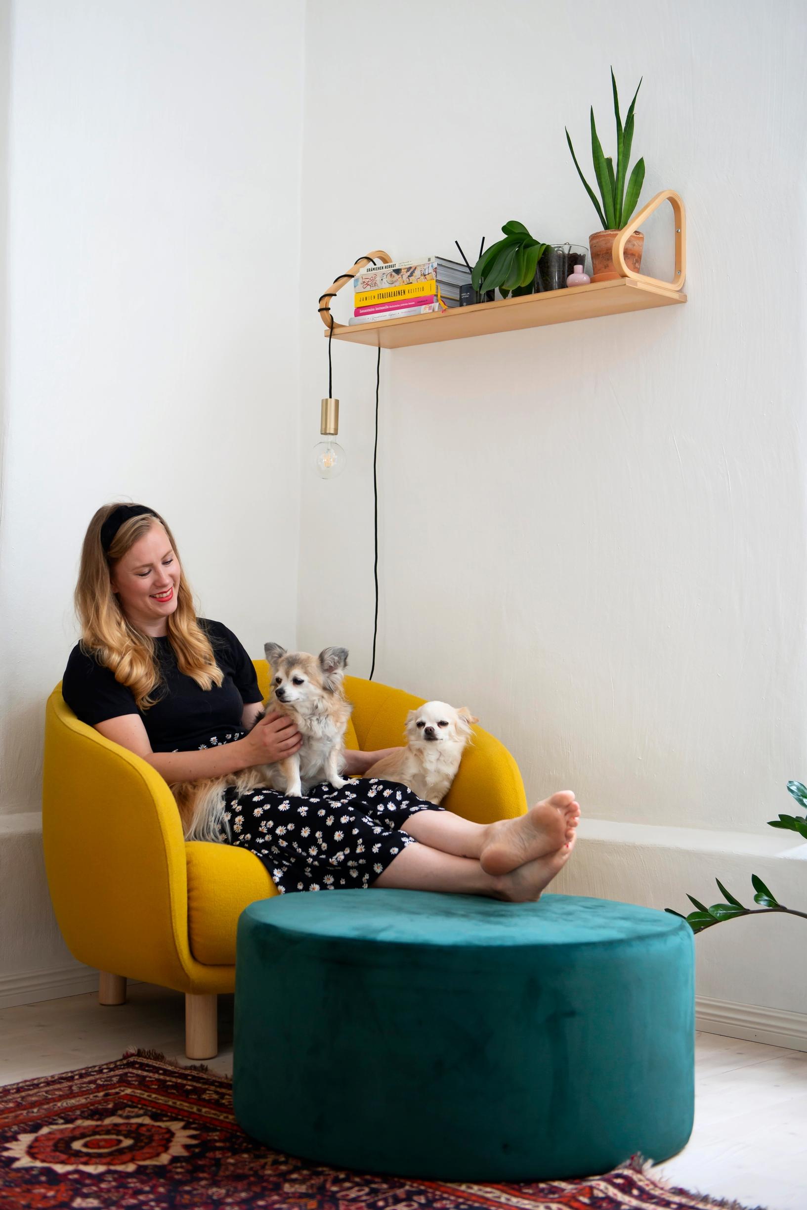 Photo of a woman in a Hakola armchair.