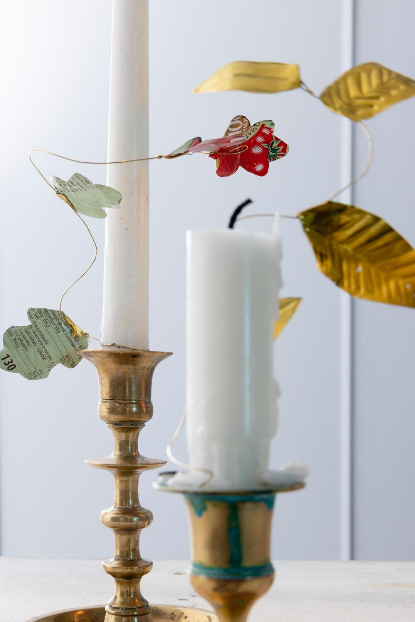 Metal ornaments on candles.