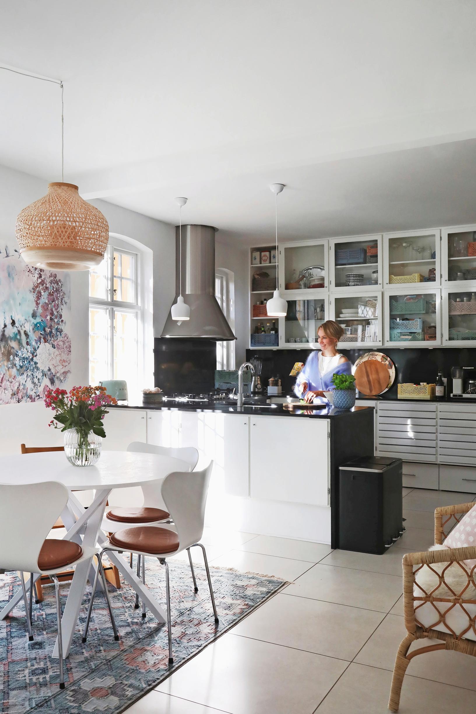 A black-and-white kitchen with glass doors