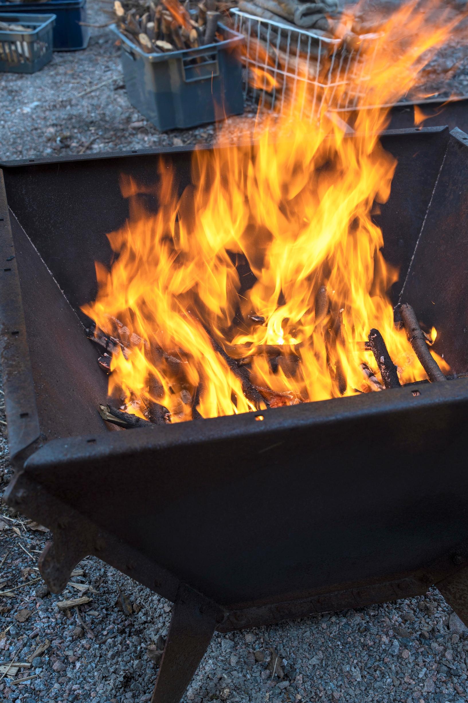 Making biochar in a cone kiln