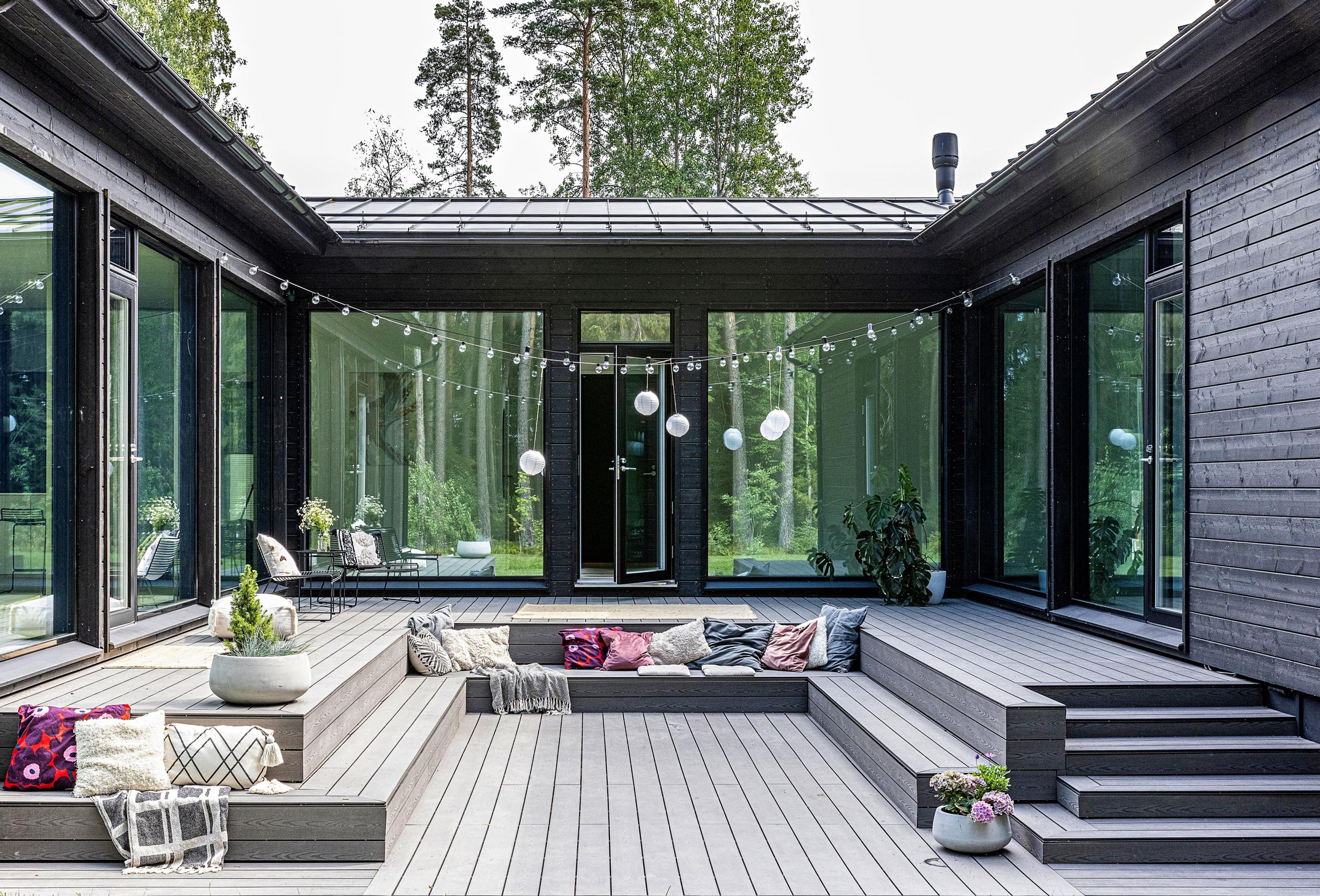 In the shelter of an atrium house, a tiered, sunken seating area