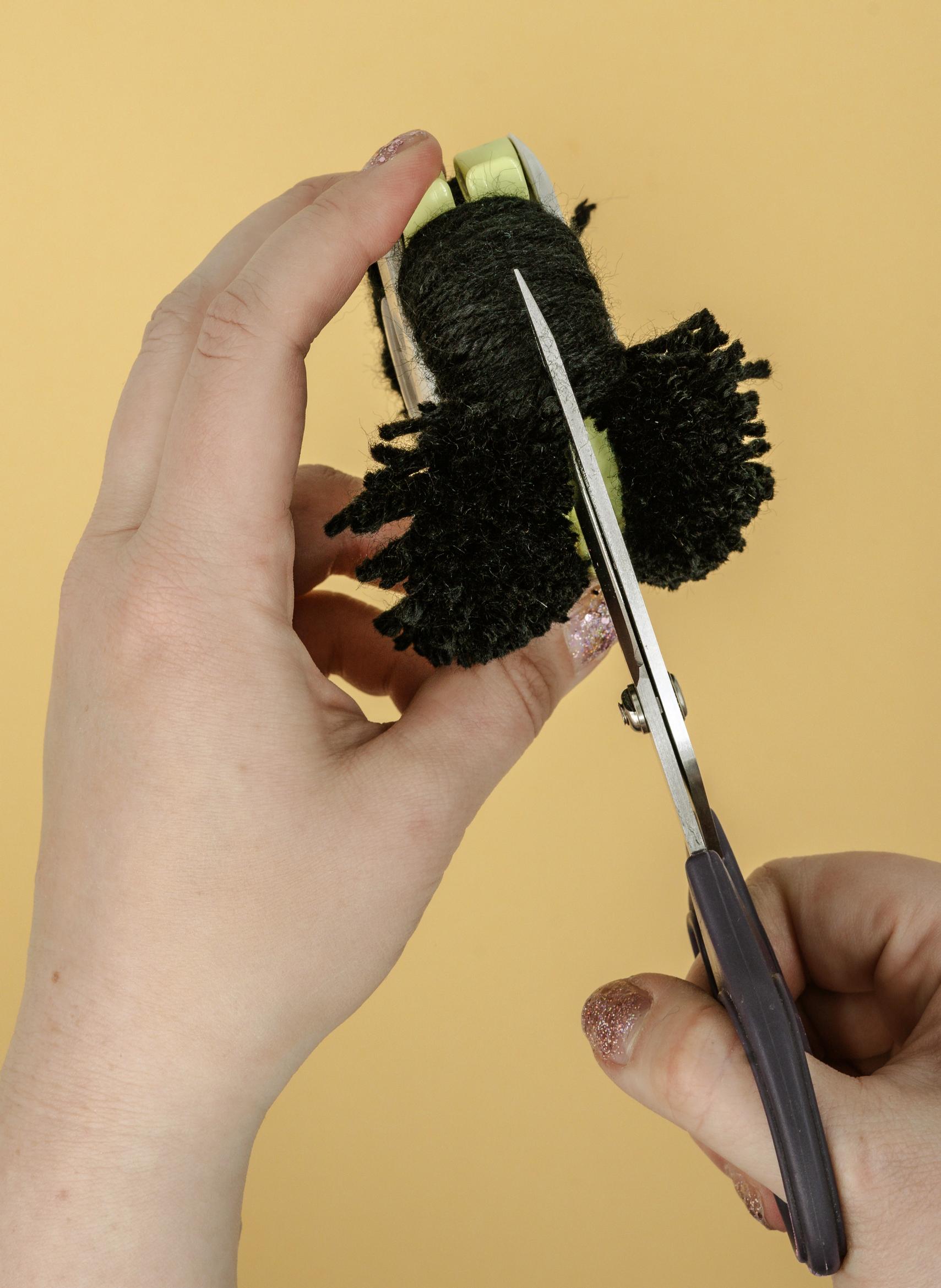 cutting the loops of yarn