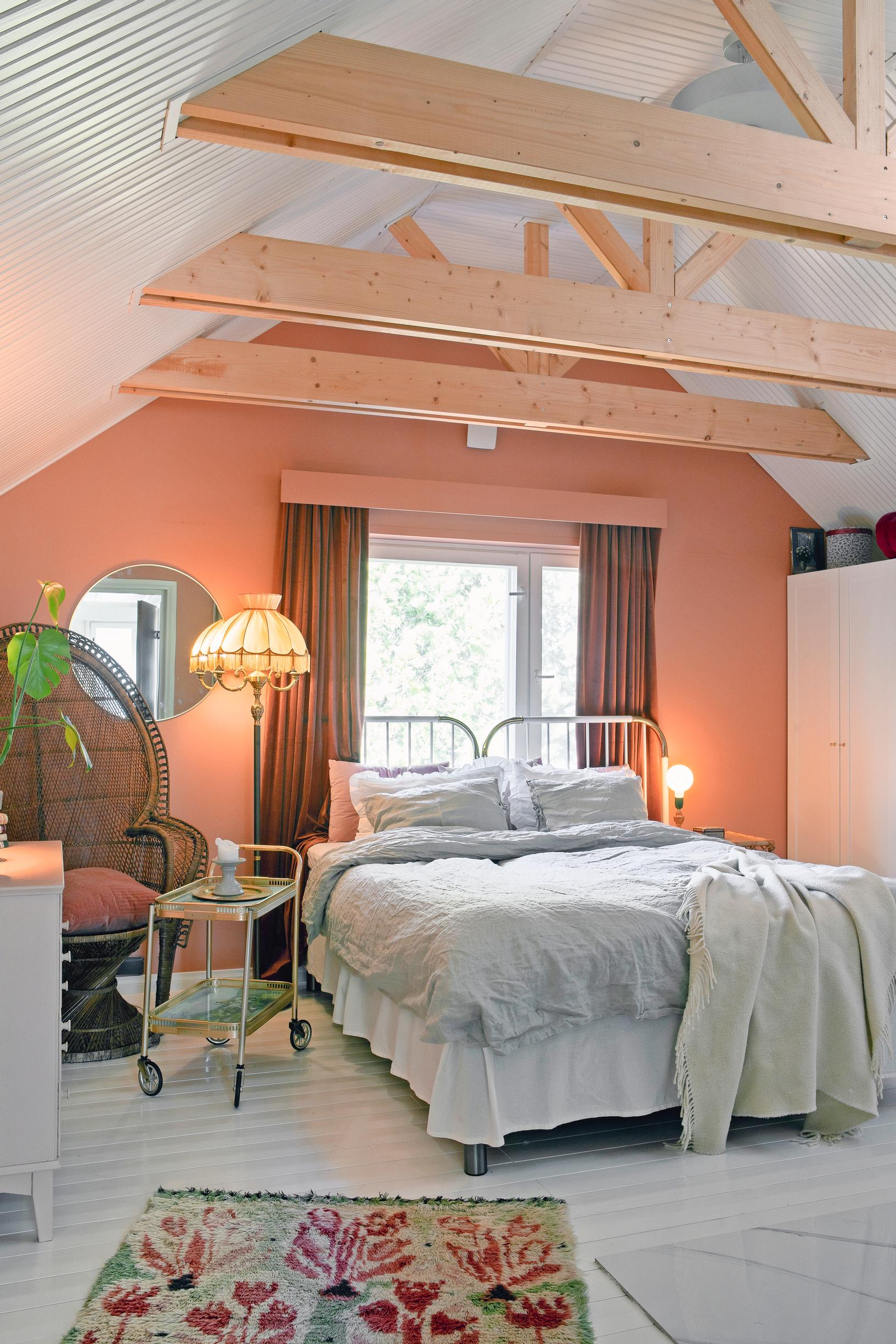 attic bedroom with exposed beams