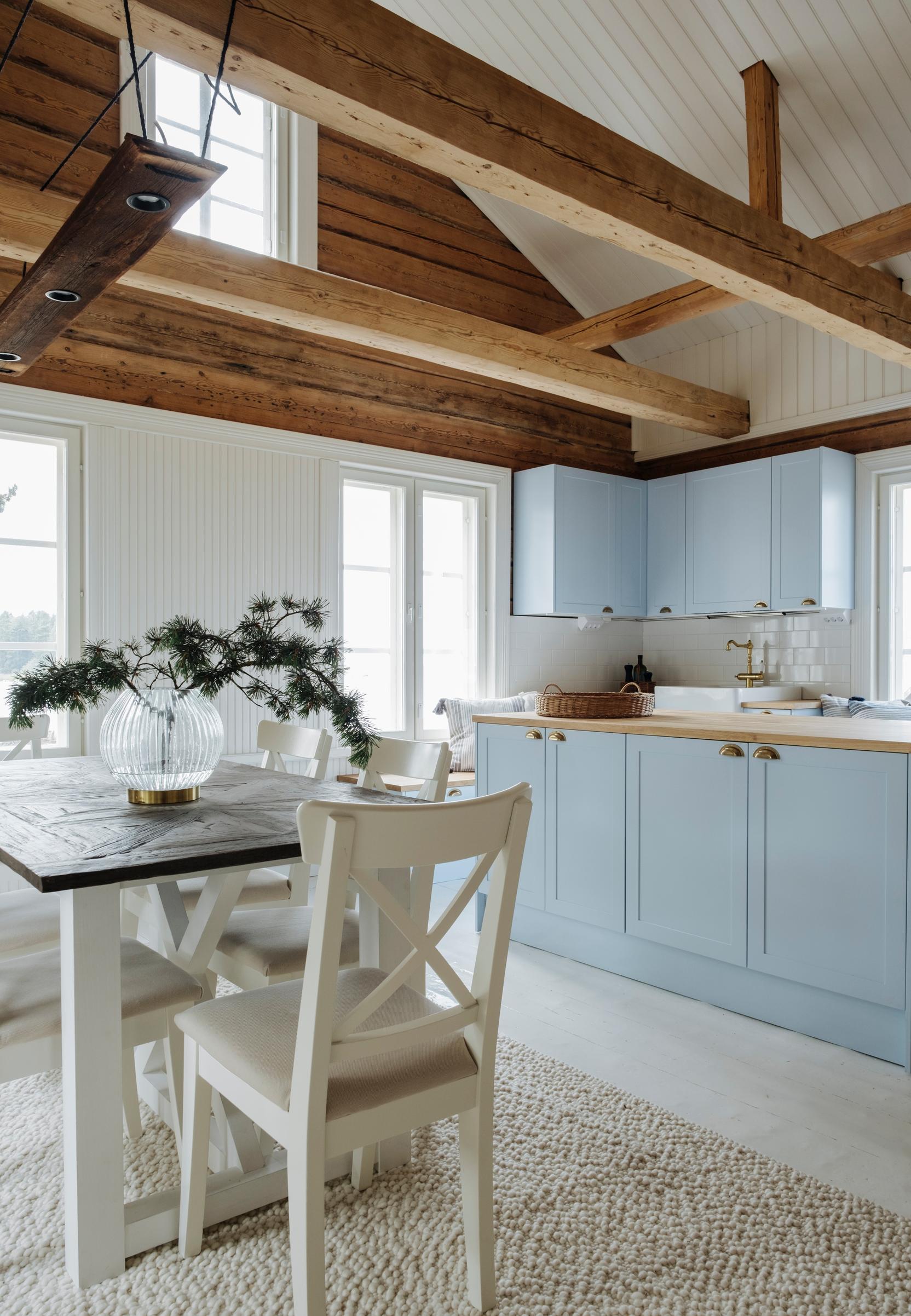 Light blue Novart kitchen in a high living room